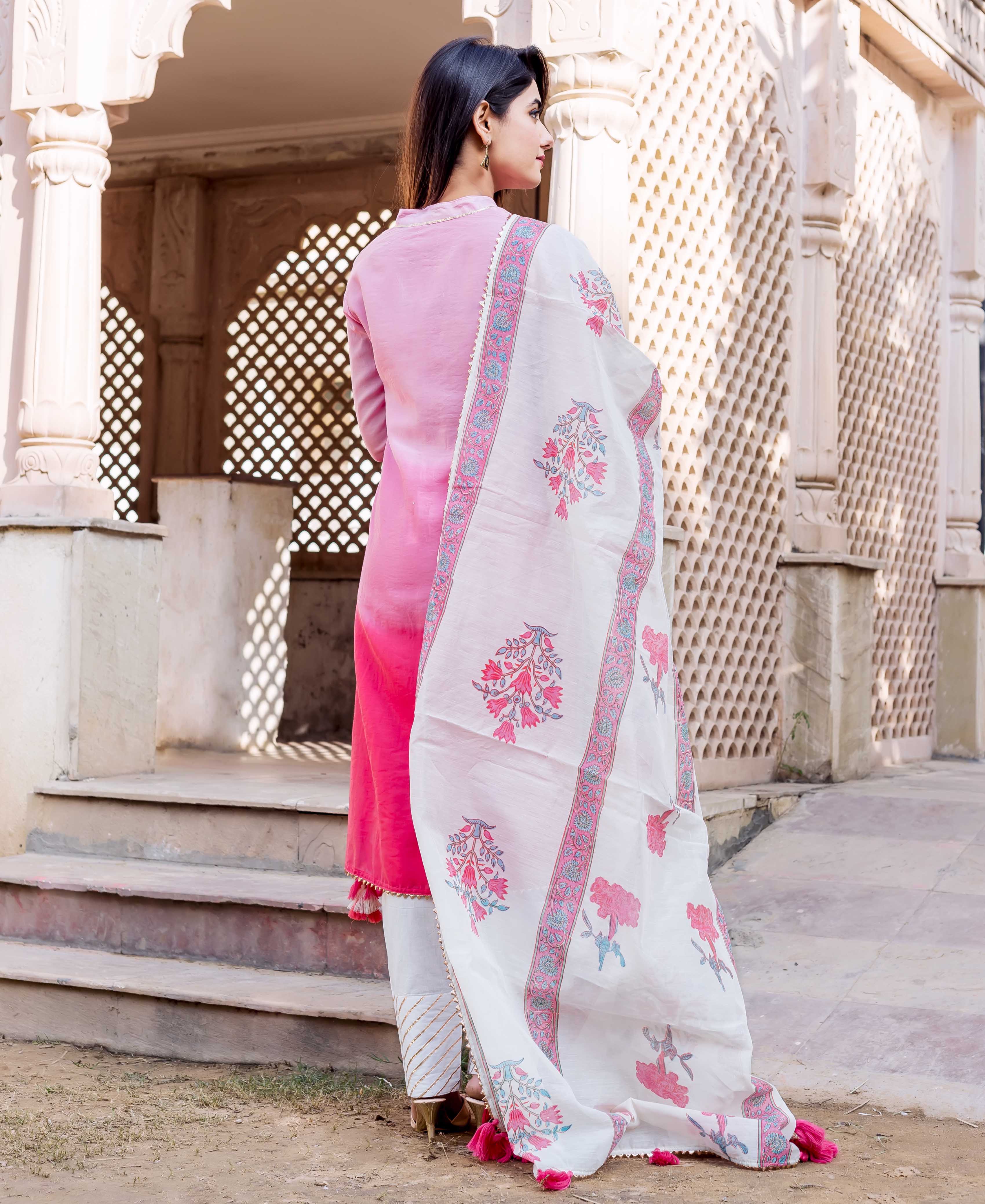 Back view: model wears ombre pink kurta with white floral hand-block printed dupatta.