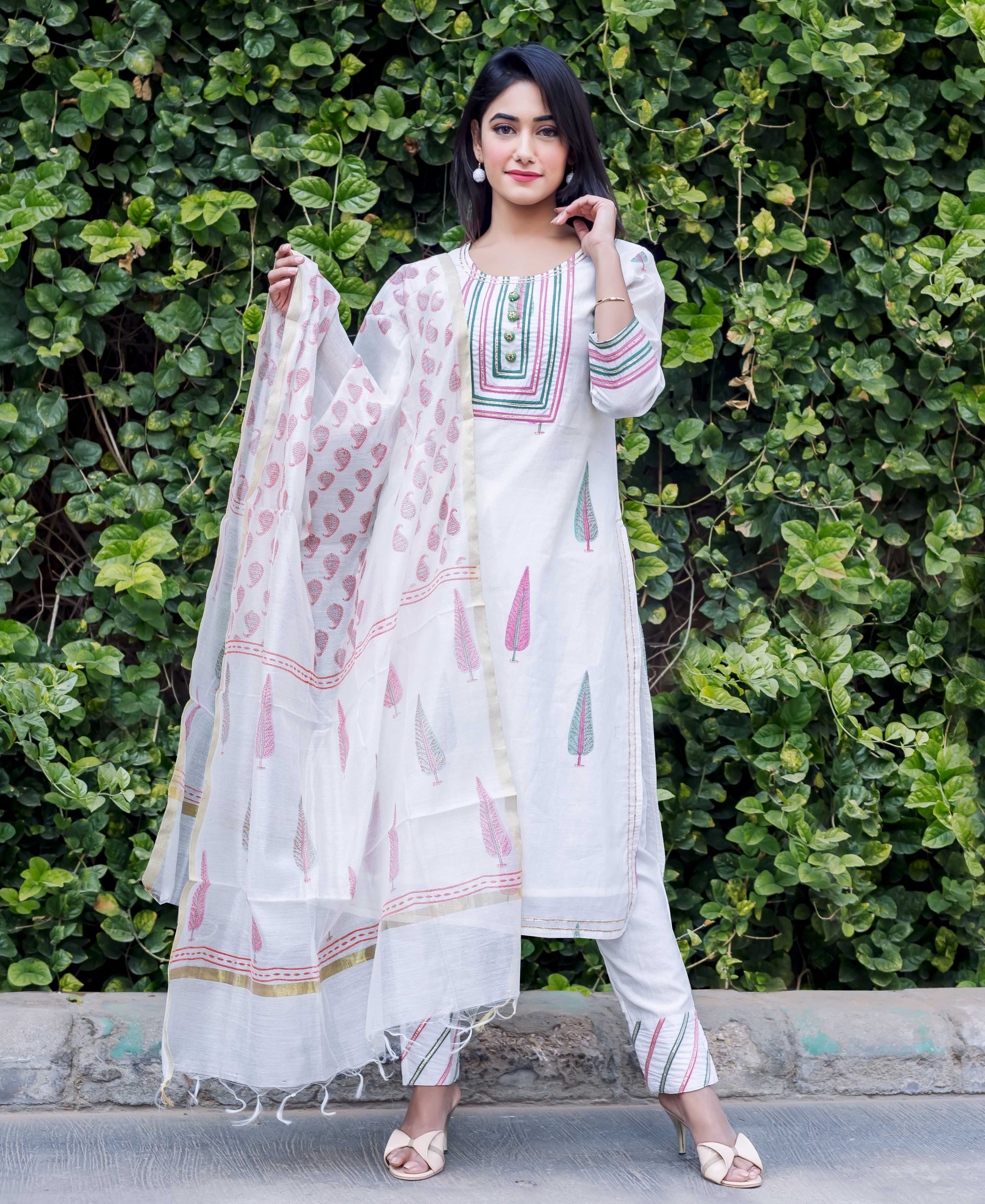 Full-length model wears white chanderi kurta set with pink and green block print.