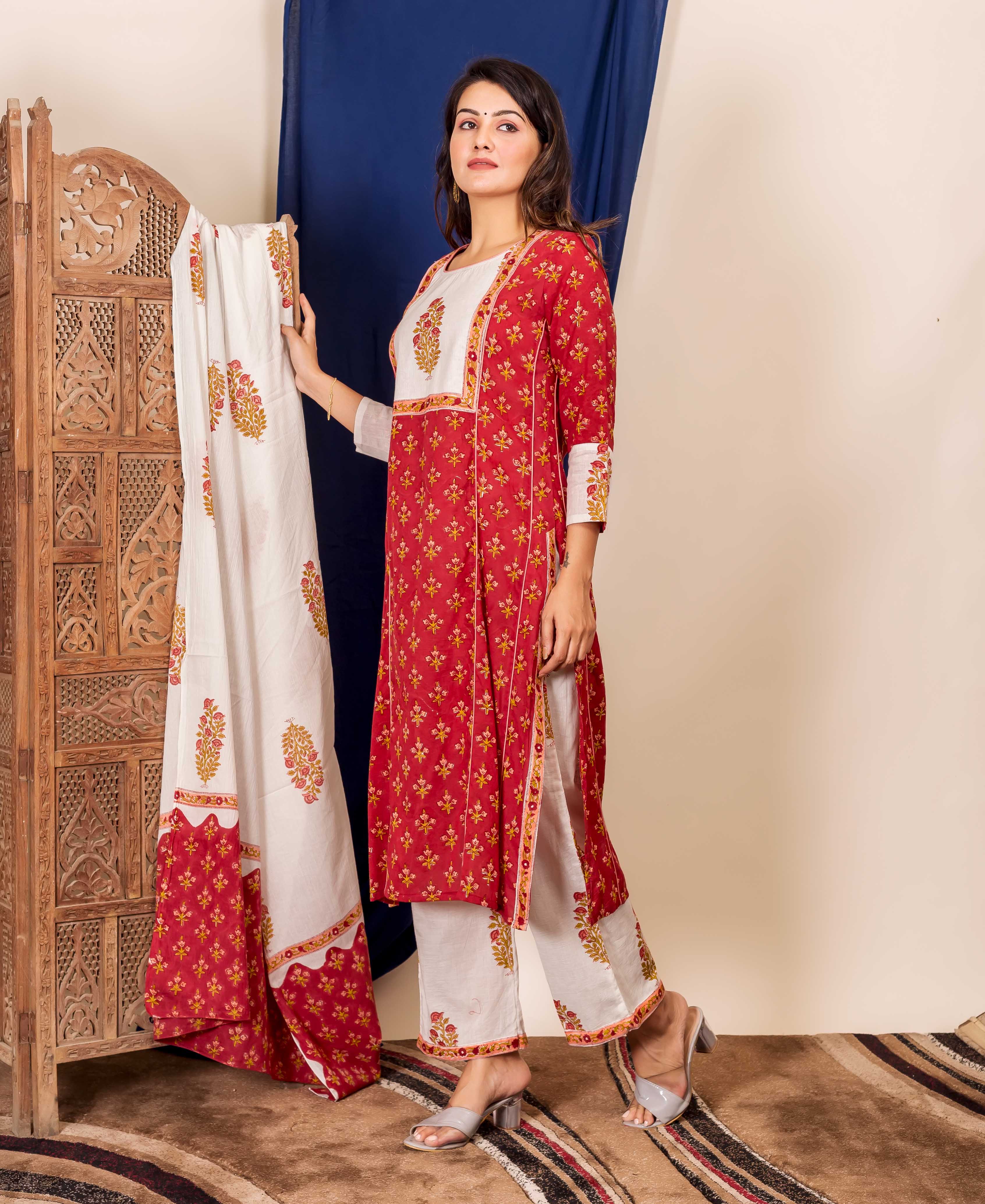 Full-body model wearing a maroon and peach floral block-printed ethnic kurta set.