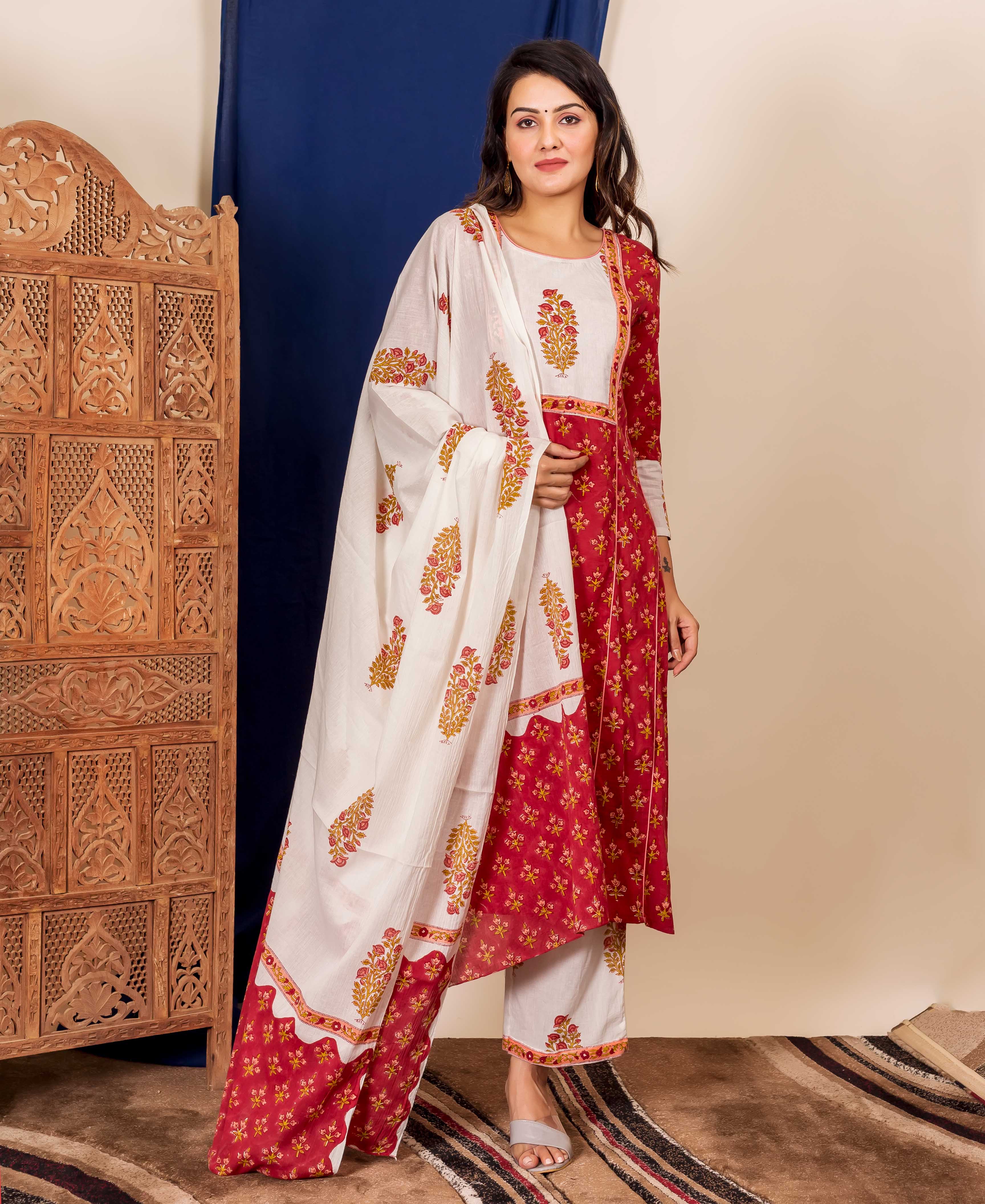 Model in a maroon and off-white ethnic kurta set featuring peach floral hand-block prints.