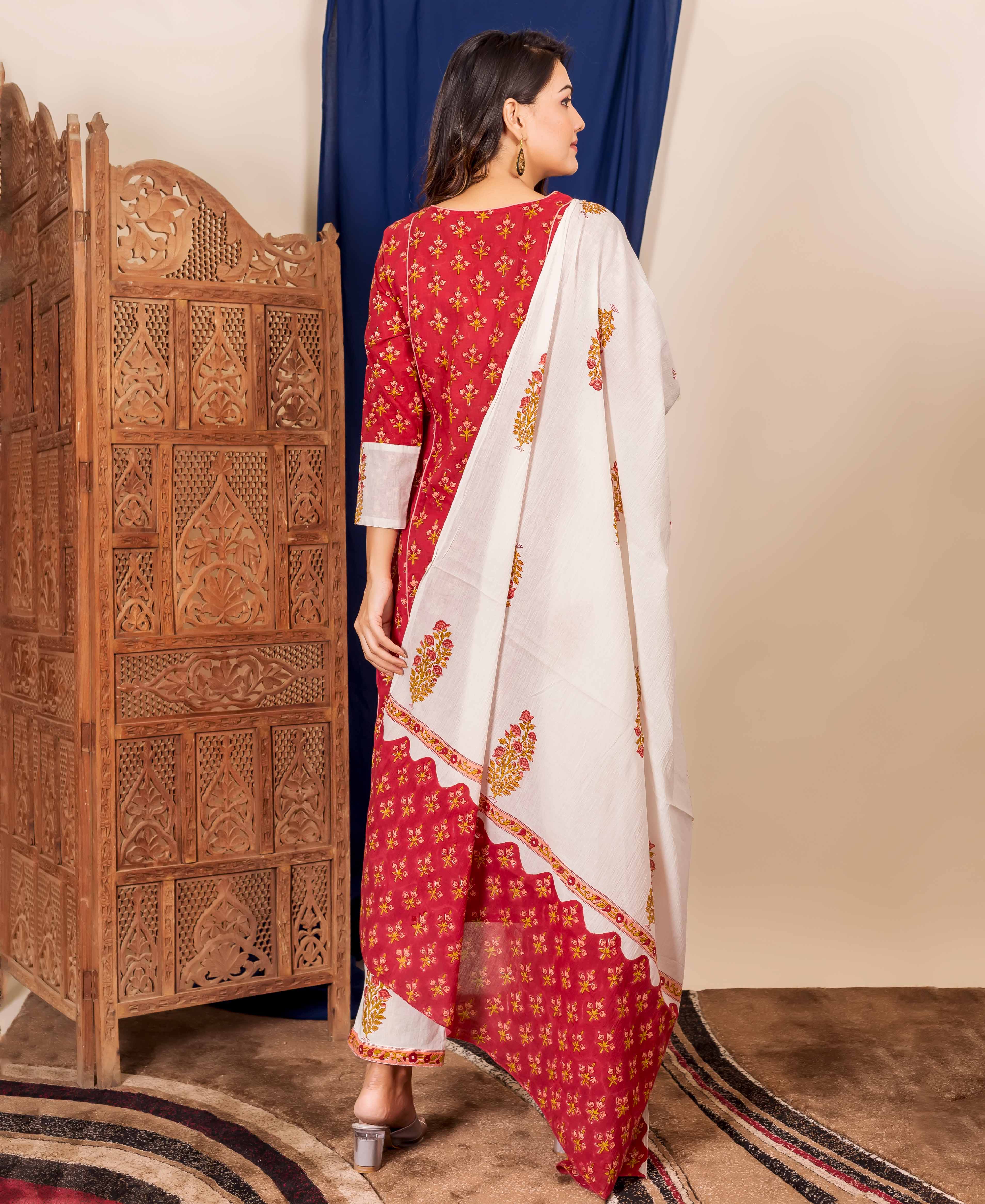 Maroon and peach block-printed kurta set with white dupatta on a model from the back.