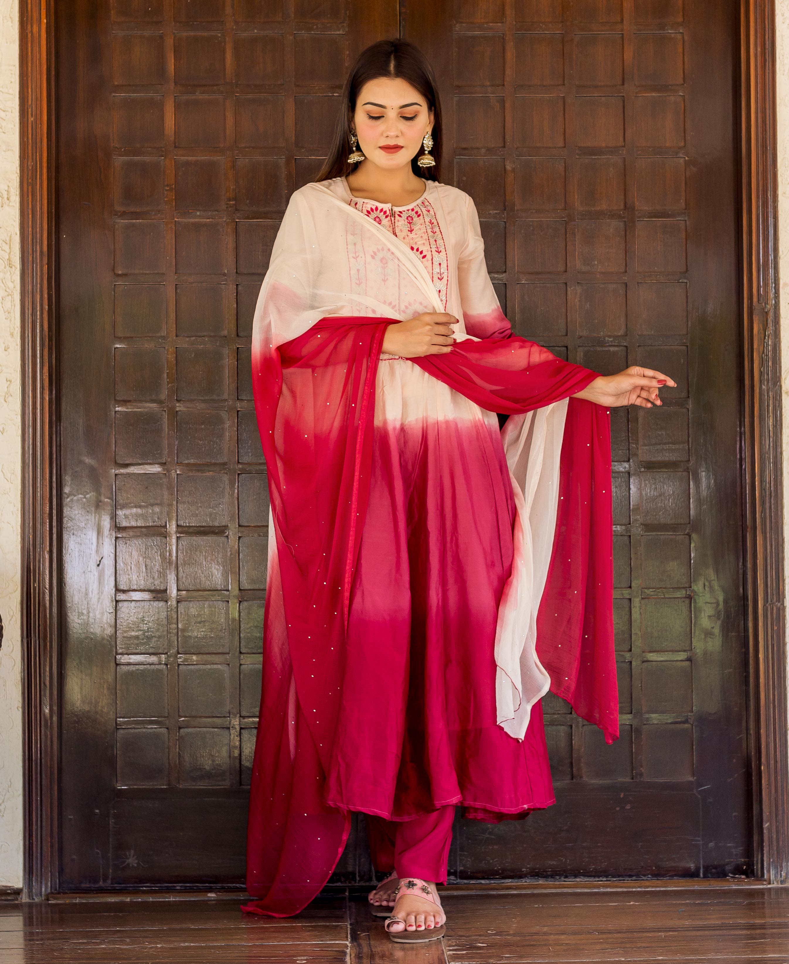 Model in cream to burgundy ombre Anarkali kurta set with delicate embroidery.