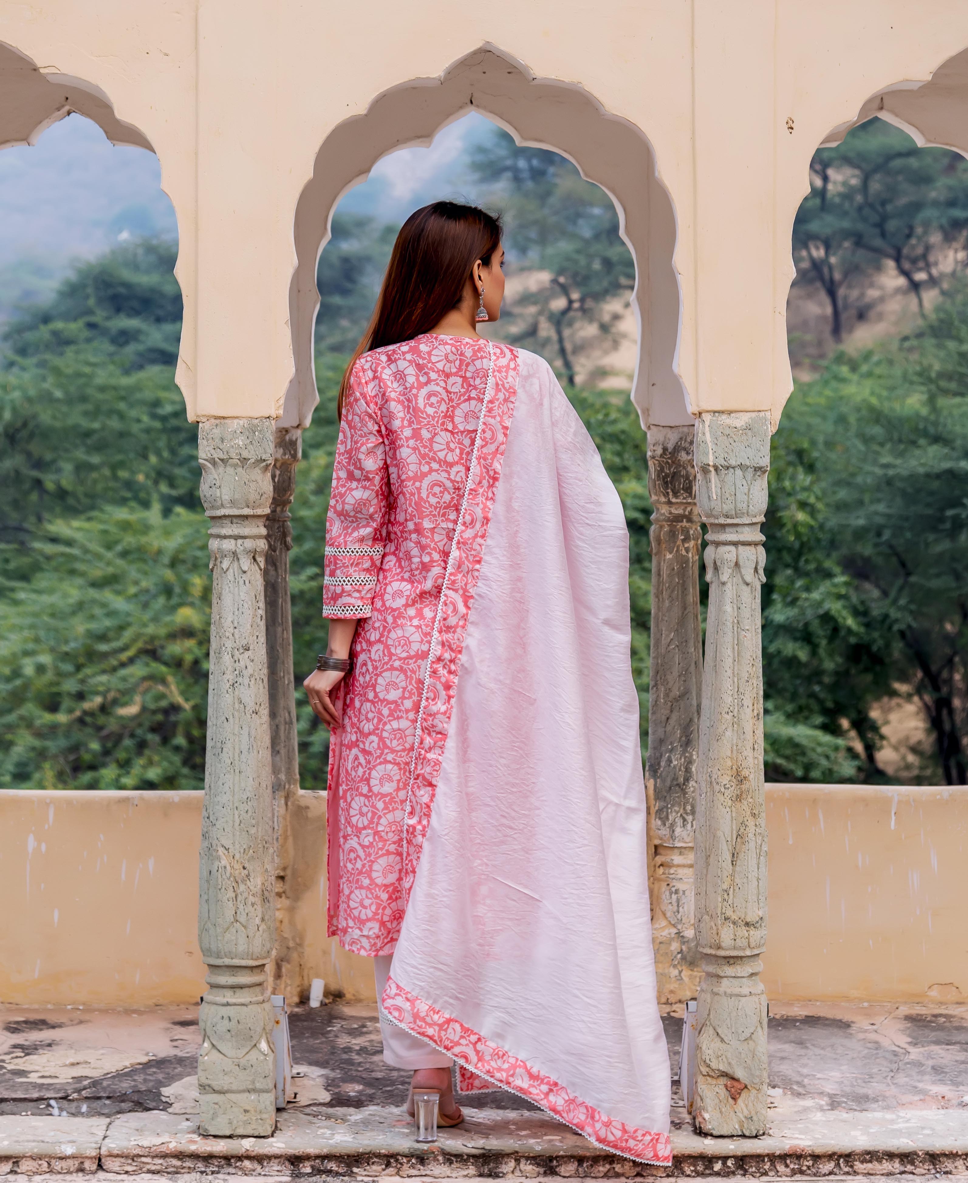 Back view model in peach and white hand block printed kurta set with dupatta.