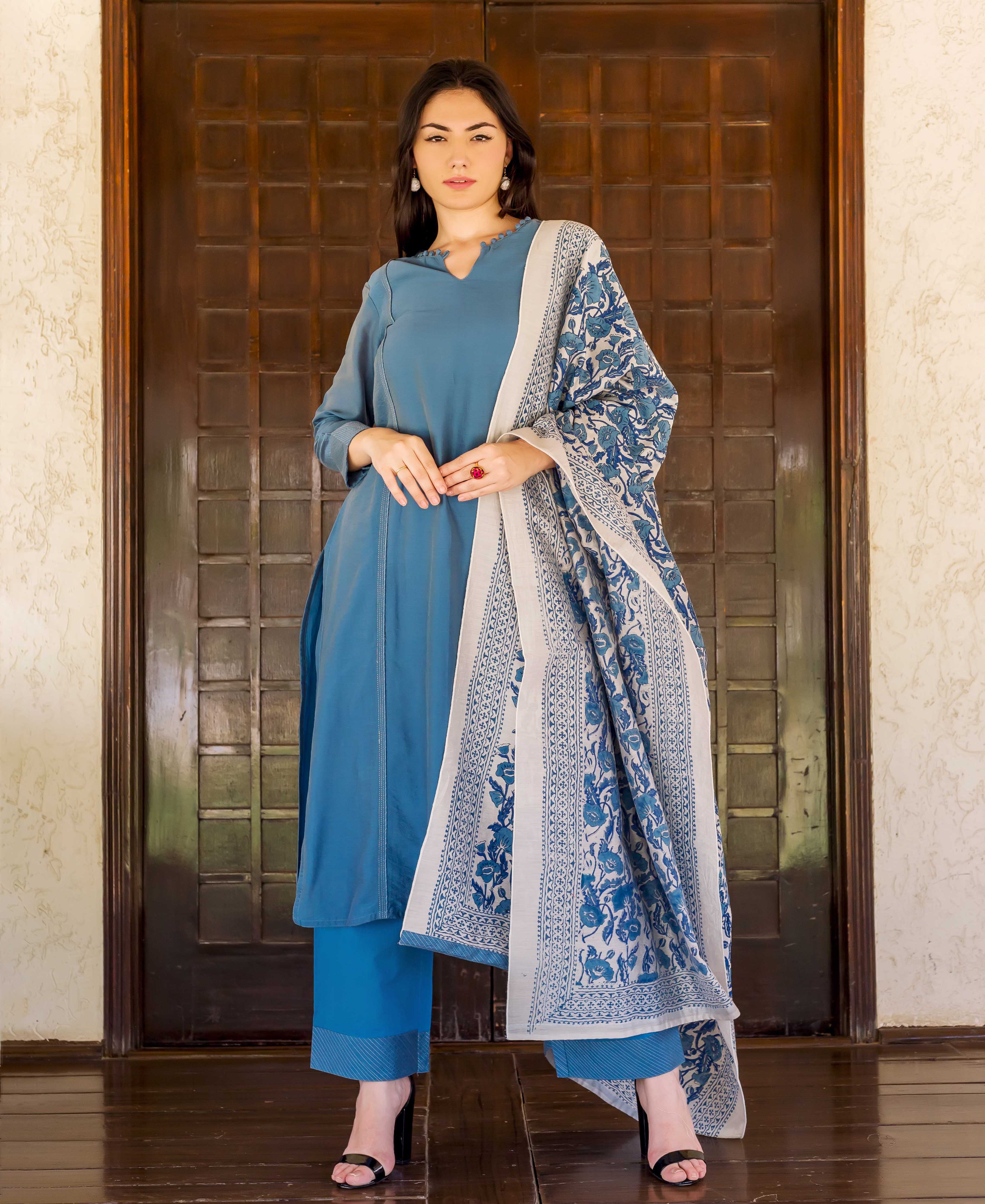 Model in a Prussian blue kurta, complemented by a white and blue floral block-printed dupatta.