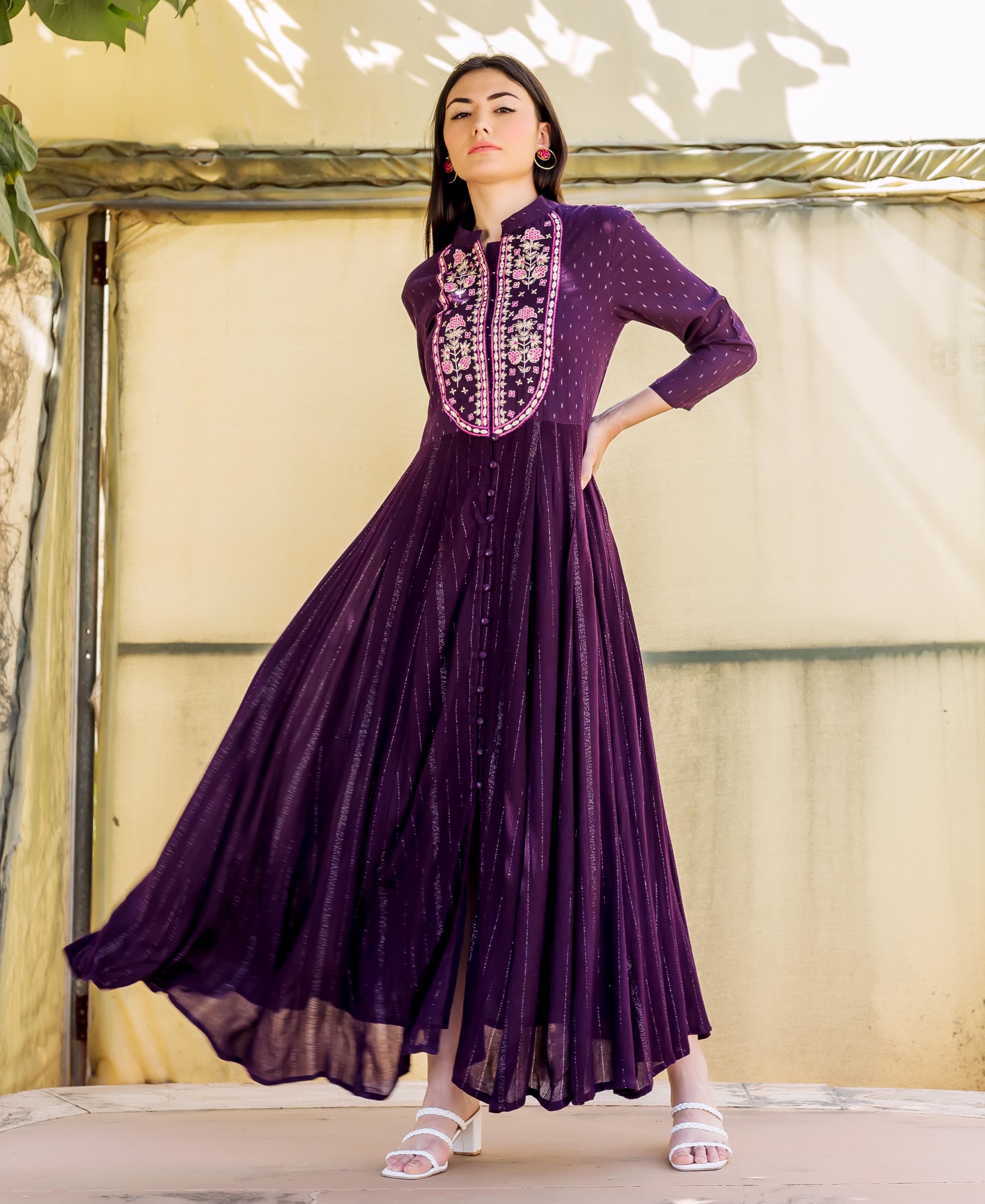 Model in flowing wine anarkali dress with lurex stripes and embroidered yoke.