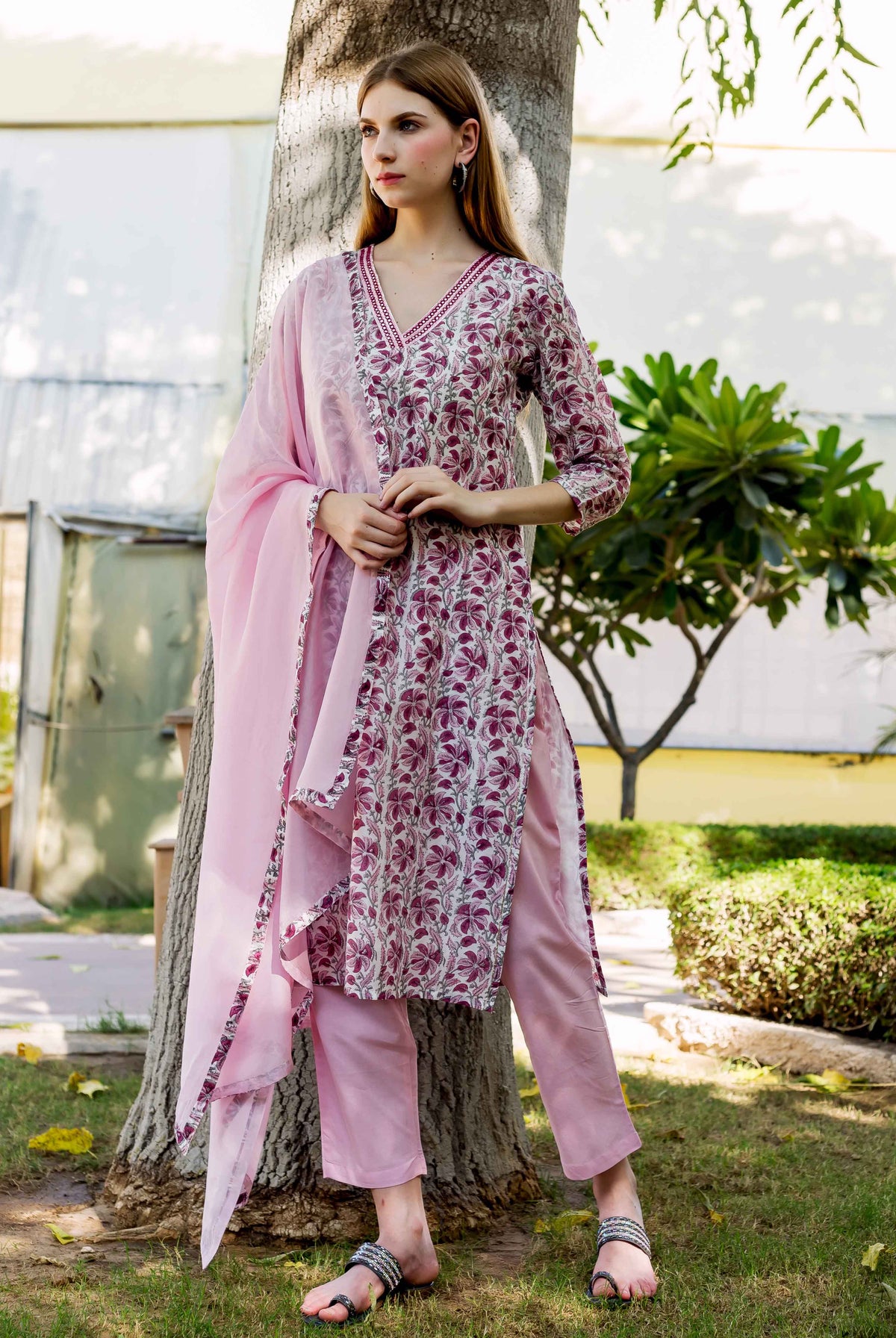 Full-length view of model in pink, white, and maroon floral hand-block-printed kurta set.