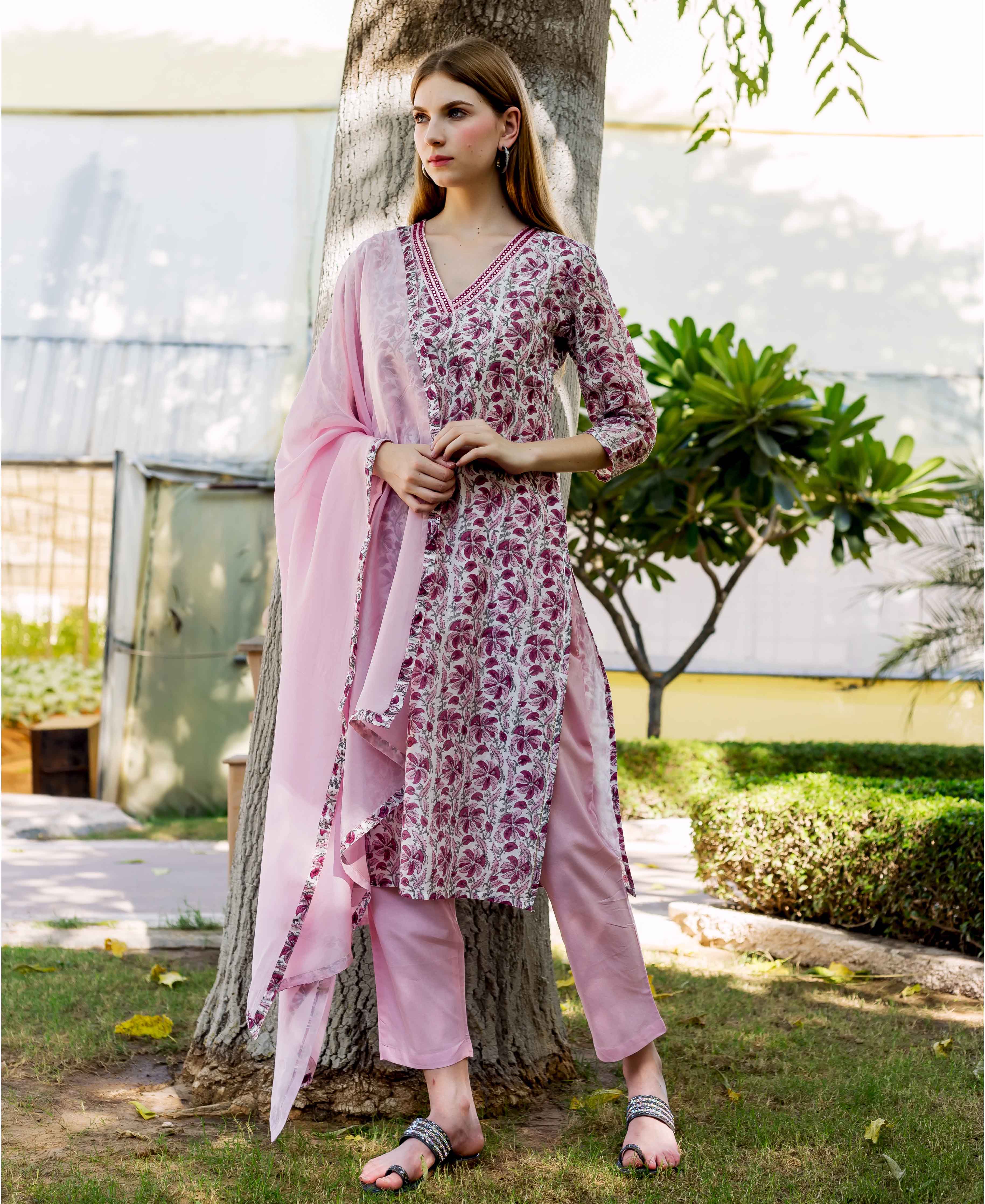 Full-length view of model in pink, white, and maroon floral hand-block-printed kurta set.