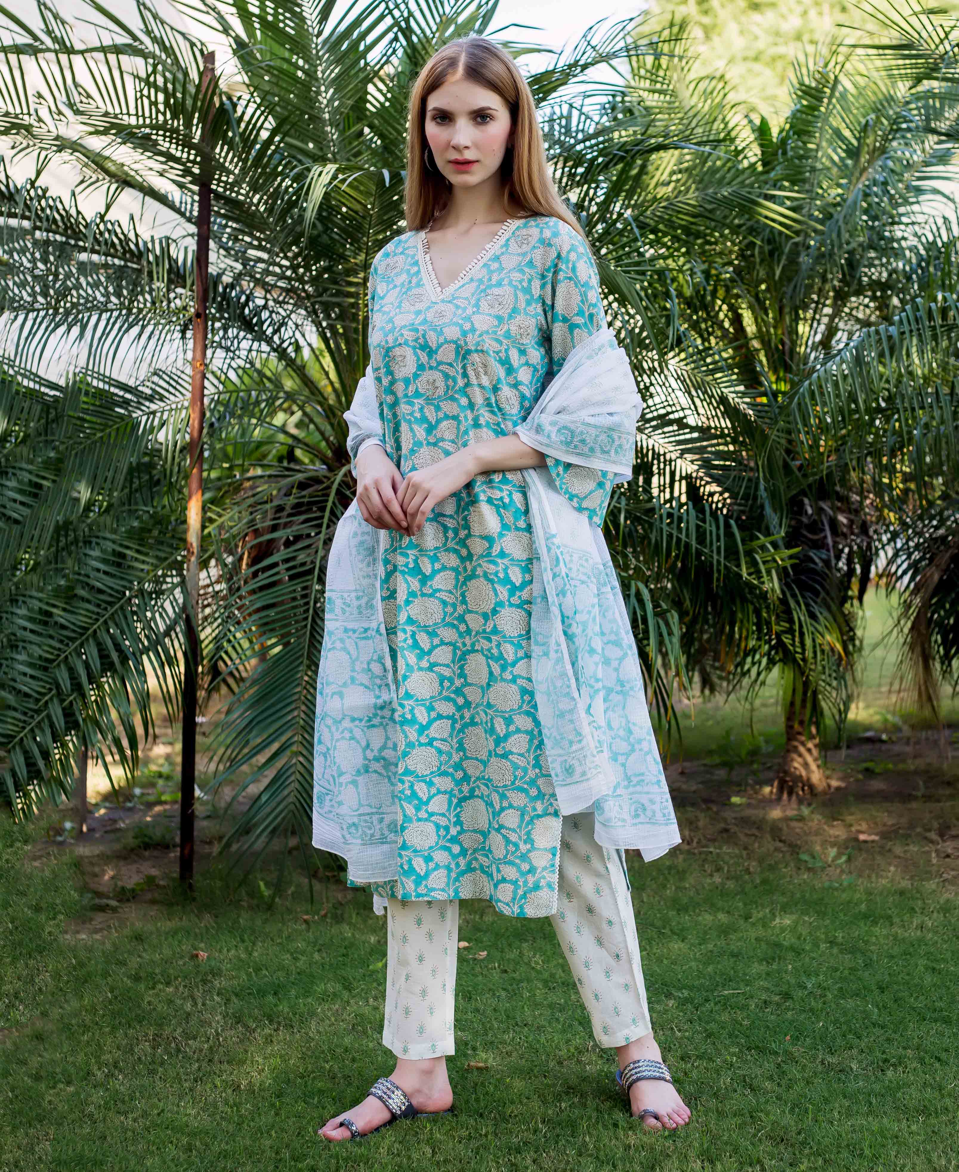 Front view model in teal hand-block-printed kurta, white pants, and sheer dupatta.