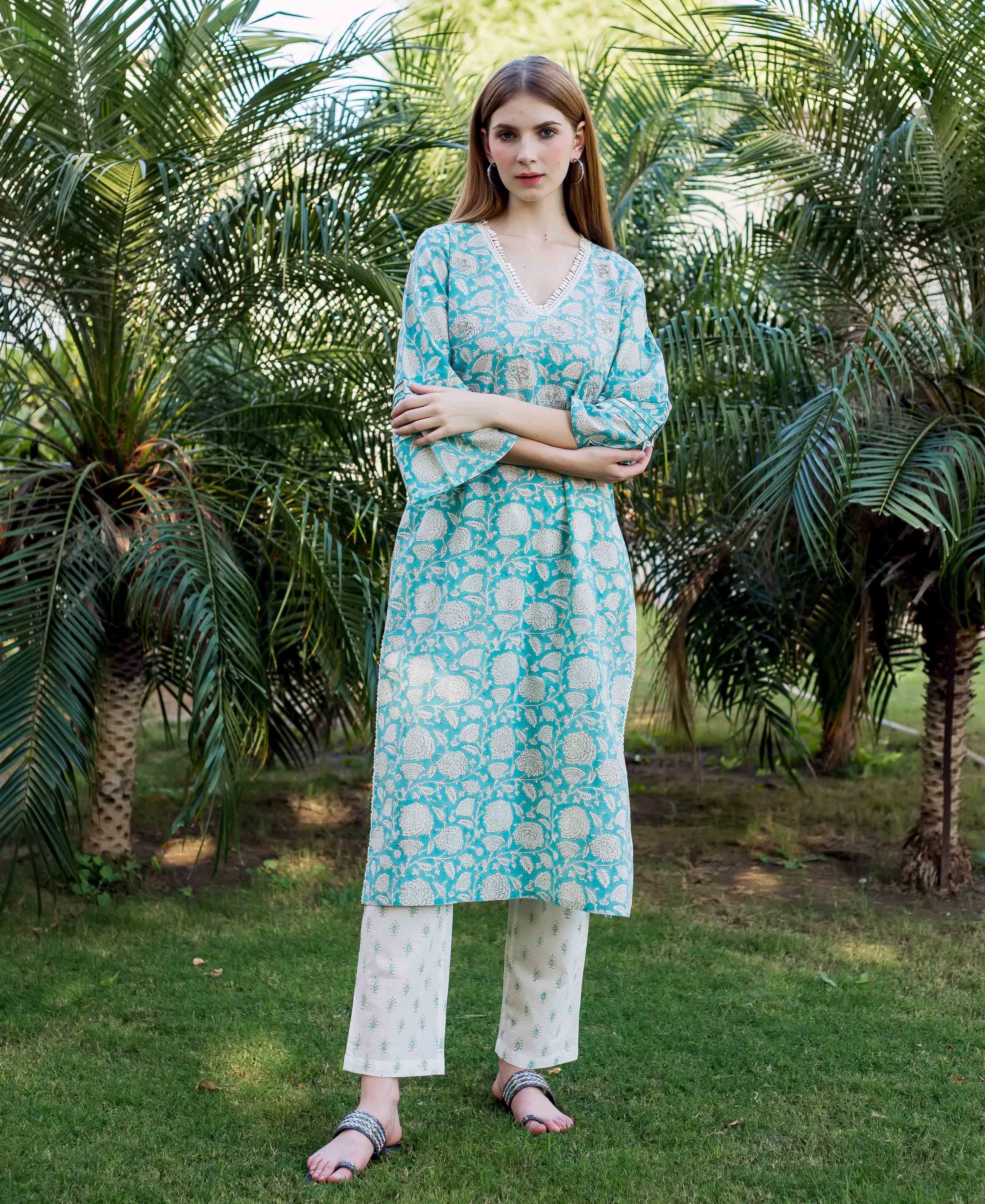 Front view model wearing teal hand-block printed kurta with embroidered neckline and cream pants.