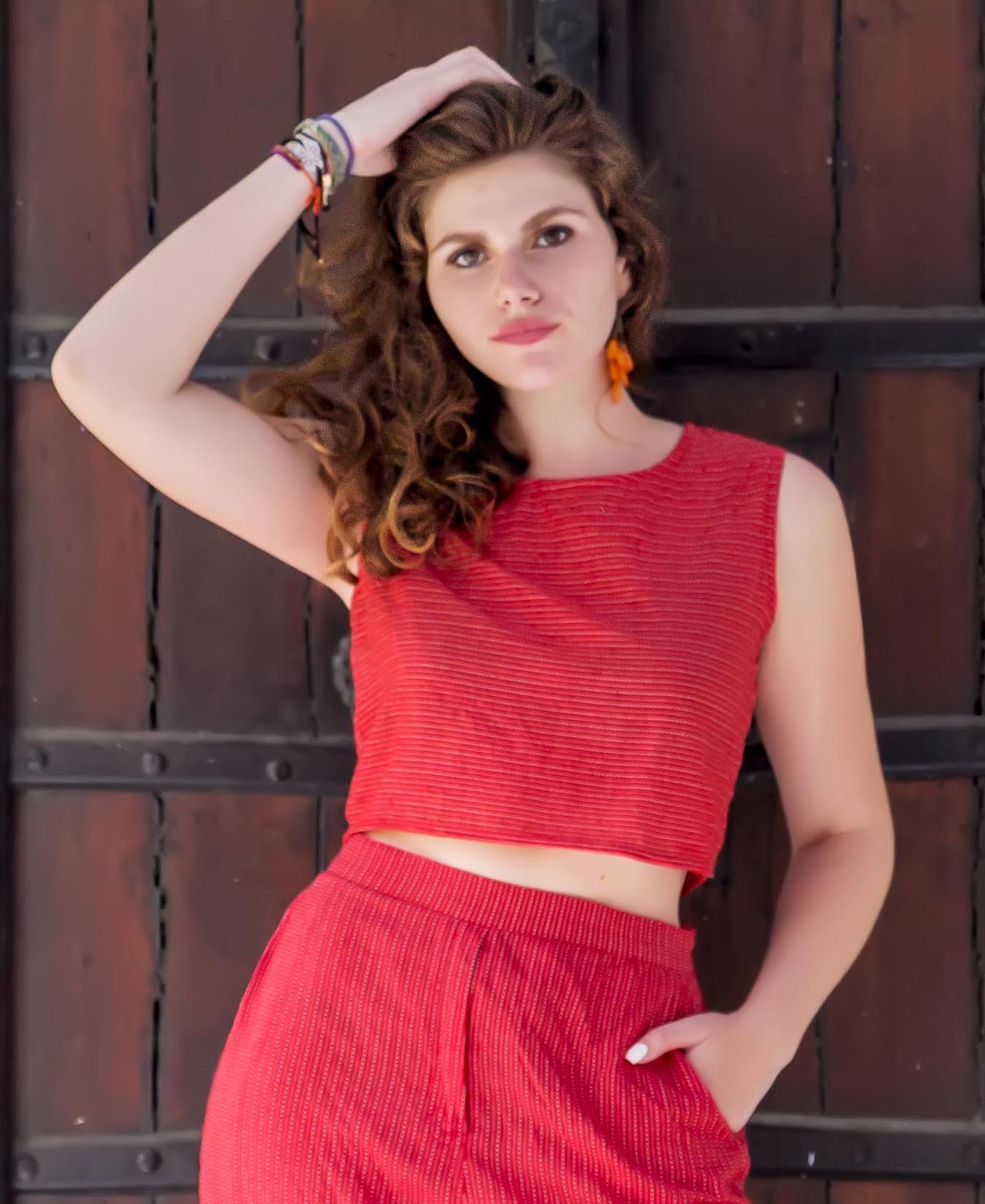 Front view of model wearing a red yarn-dyed striped crop top and matching pants.