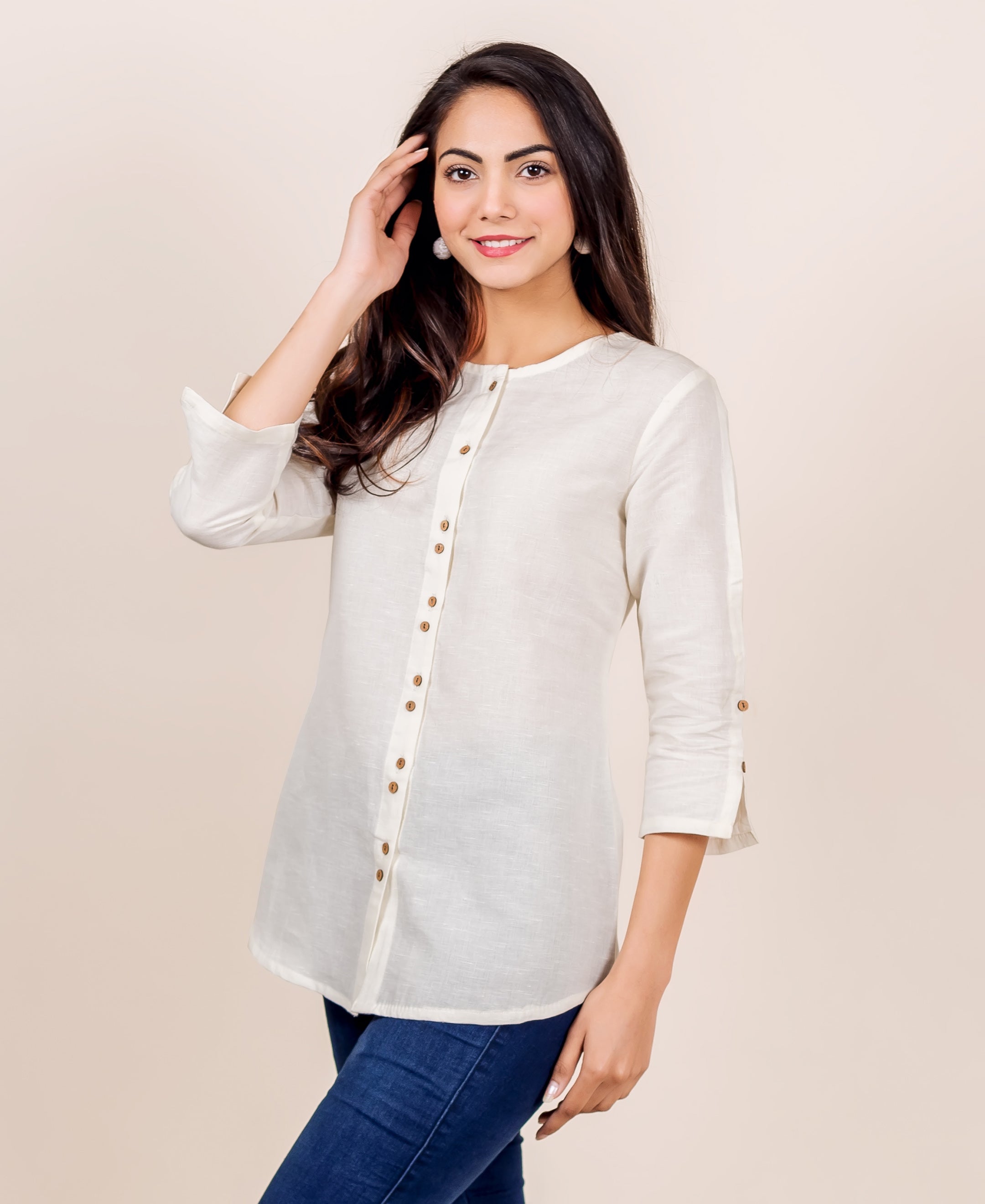 Antique white linen top with hand block print and wooden buttons down front and on sleeves.