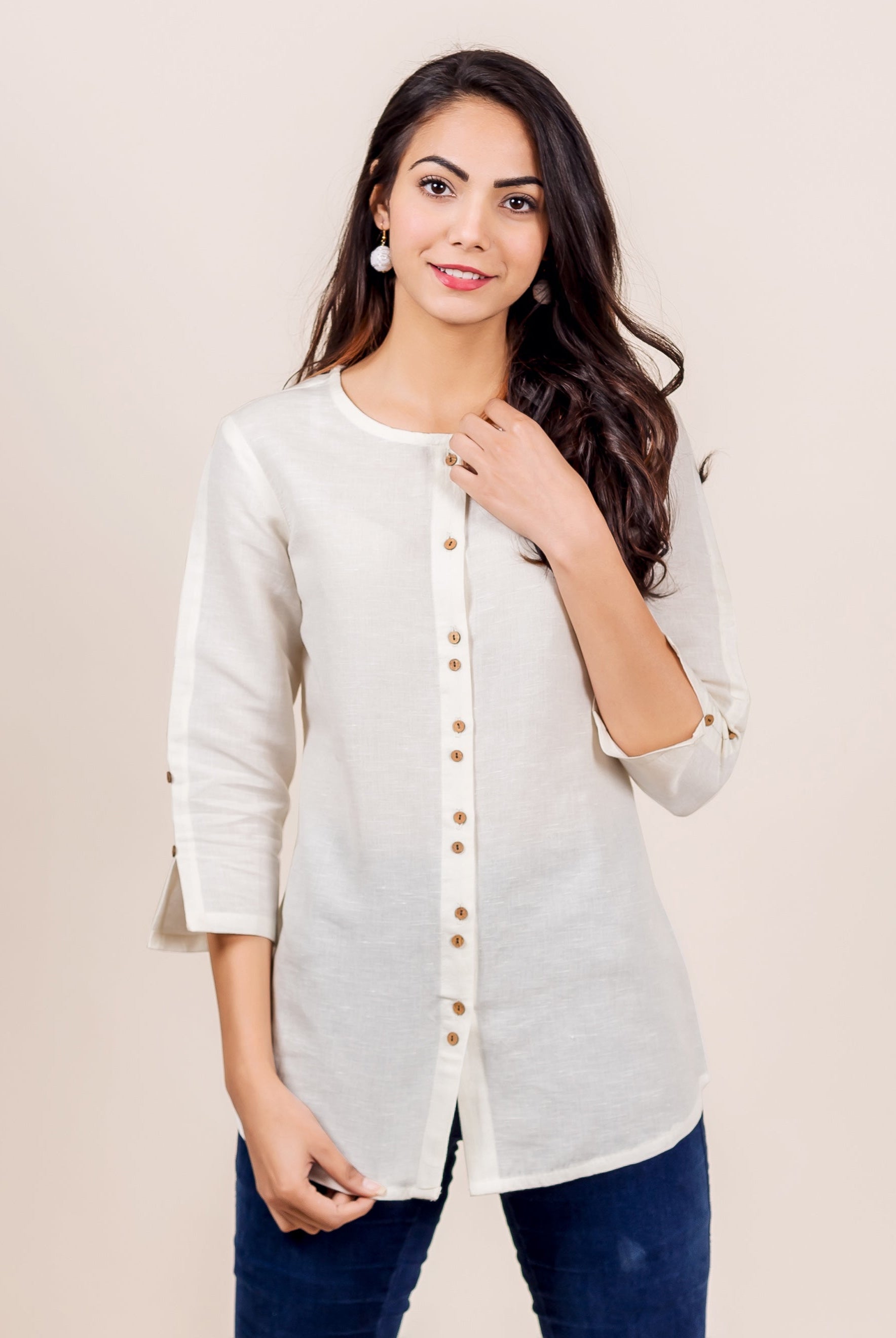 Front view: Model wearing antique white linen top with button placket, three-quarter sleeves.