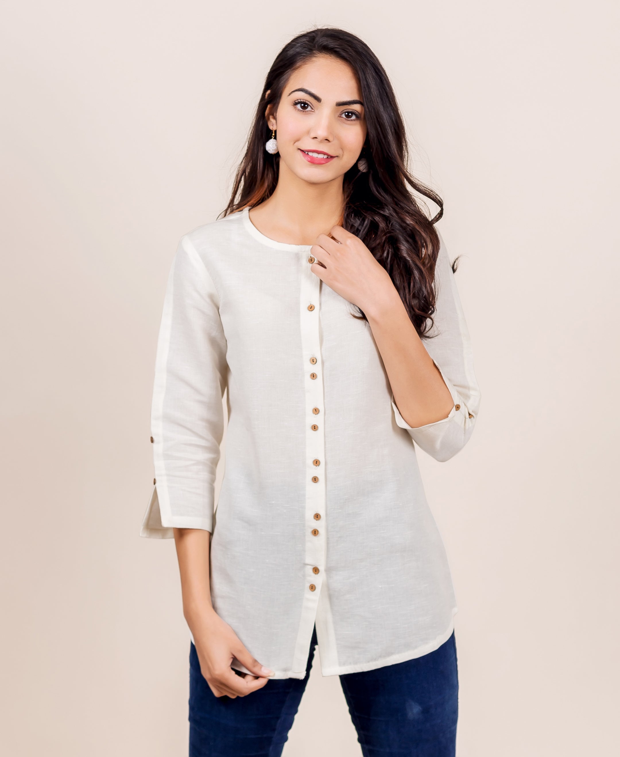 Front view: Model wearing antique white linen top with button placket, three-quarter sleeves.