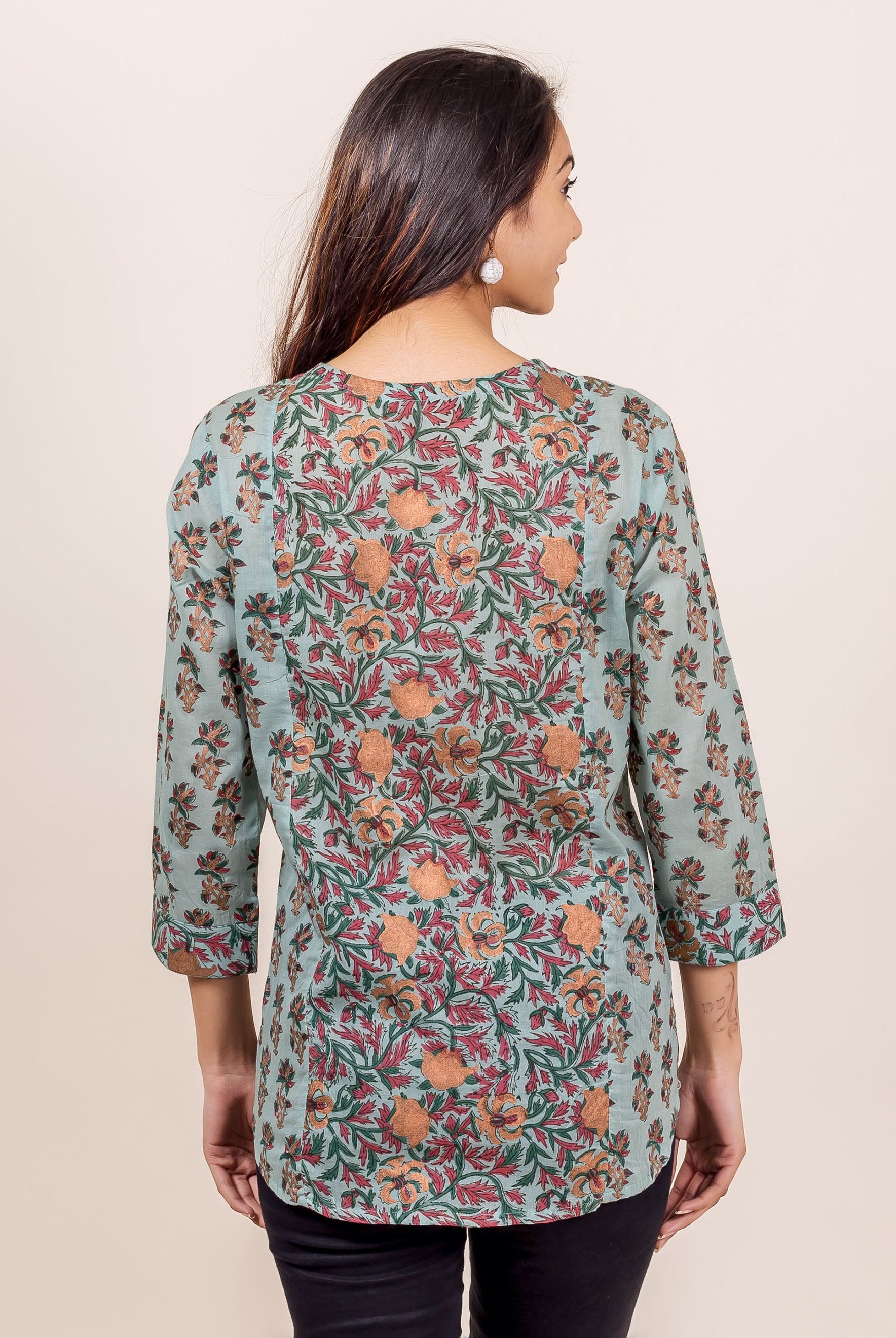 Woman's back, Turkish blue hand block printed top with red and orange florals.