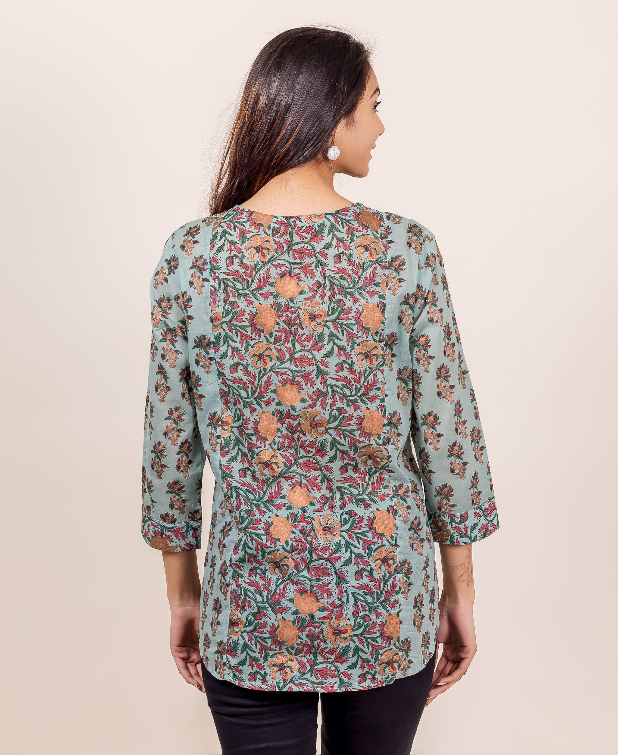 Woman's back, Turkish blue hand block printed top with red and orange florals.