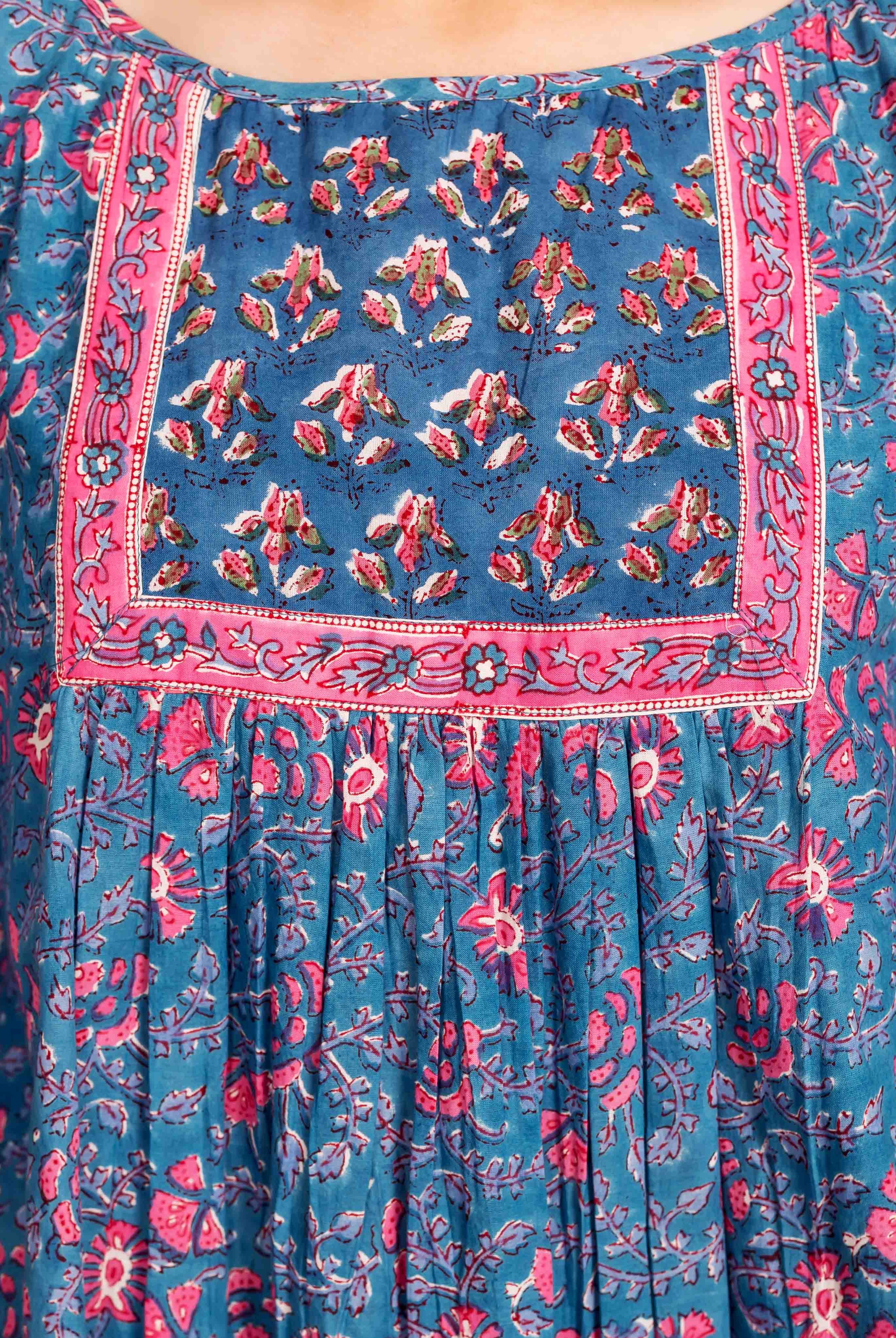 Front view of a blue and pink floral hand block printed kaftan top with square yoke.