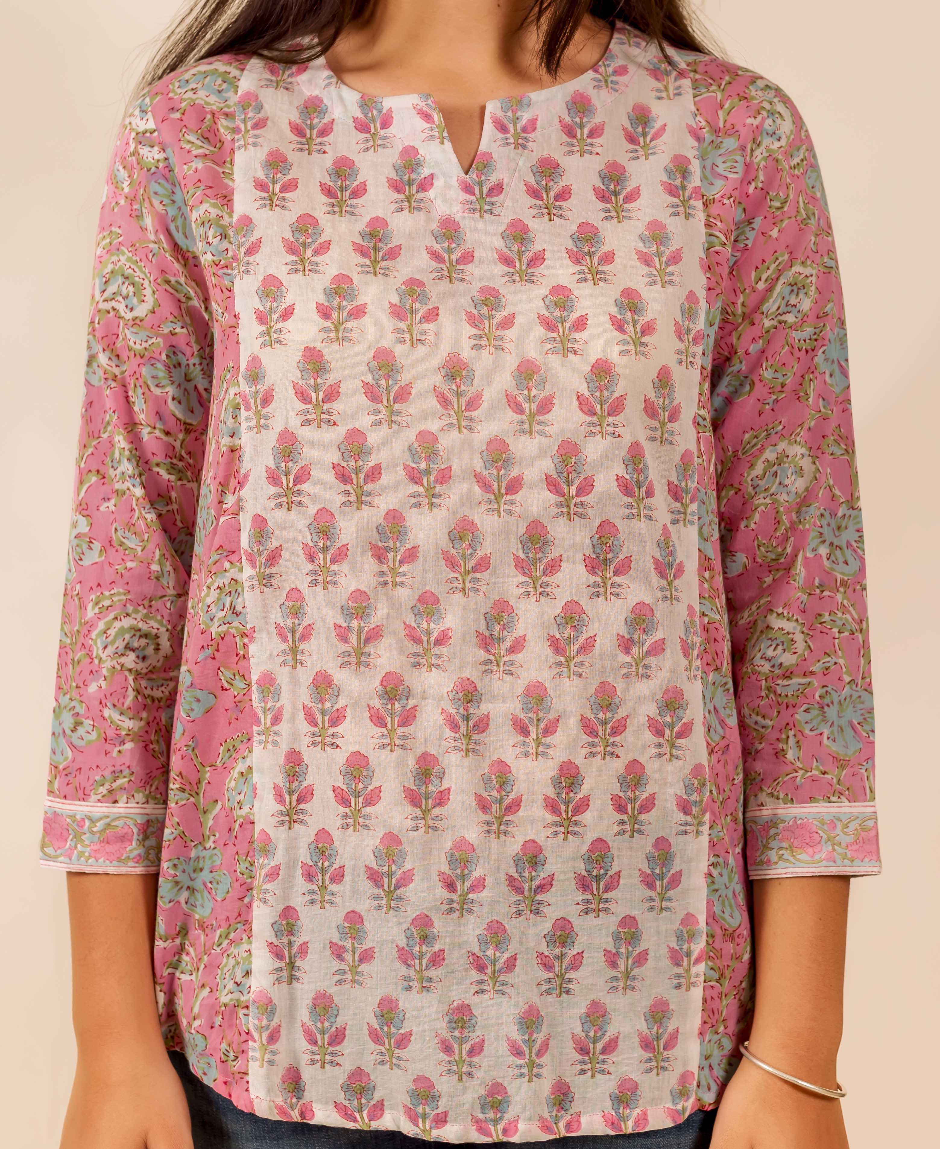 Pink and white floral hand block printed top with three-quarter sleeves and V-neck detail.