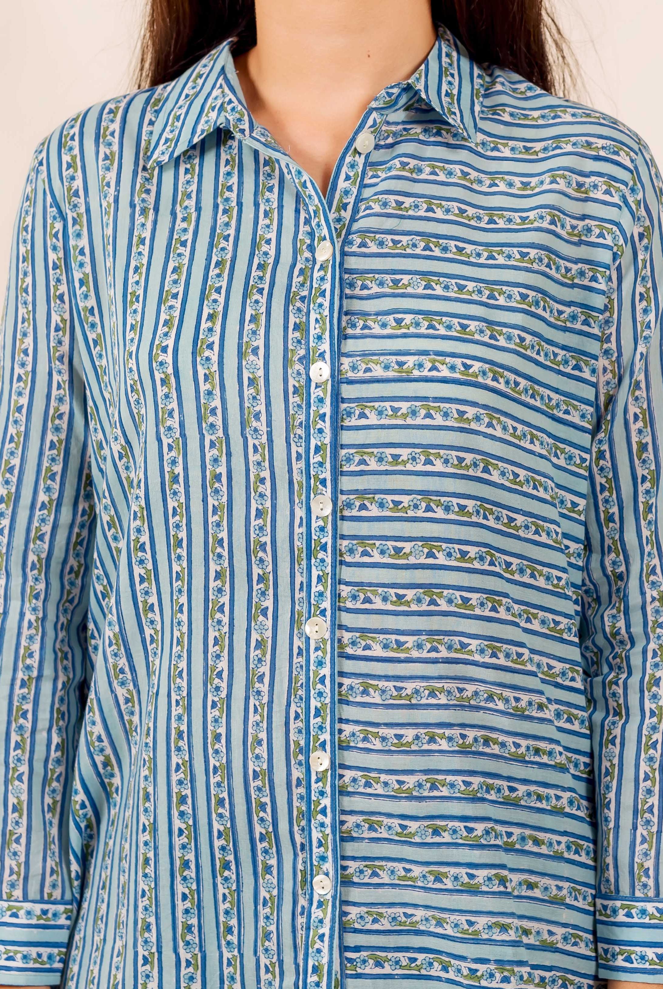 Front view of blue hand block printed shirt featuring contrasting vertical and horizontal floral stripes.