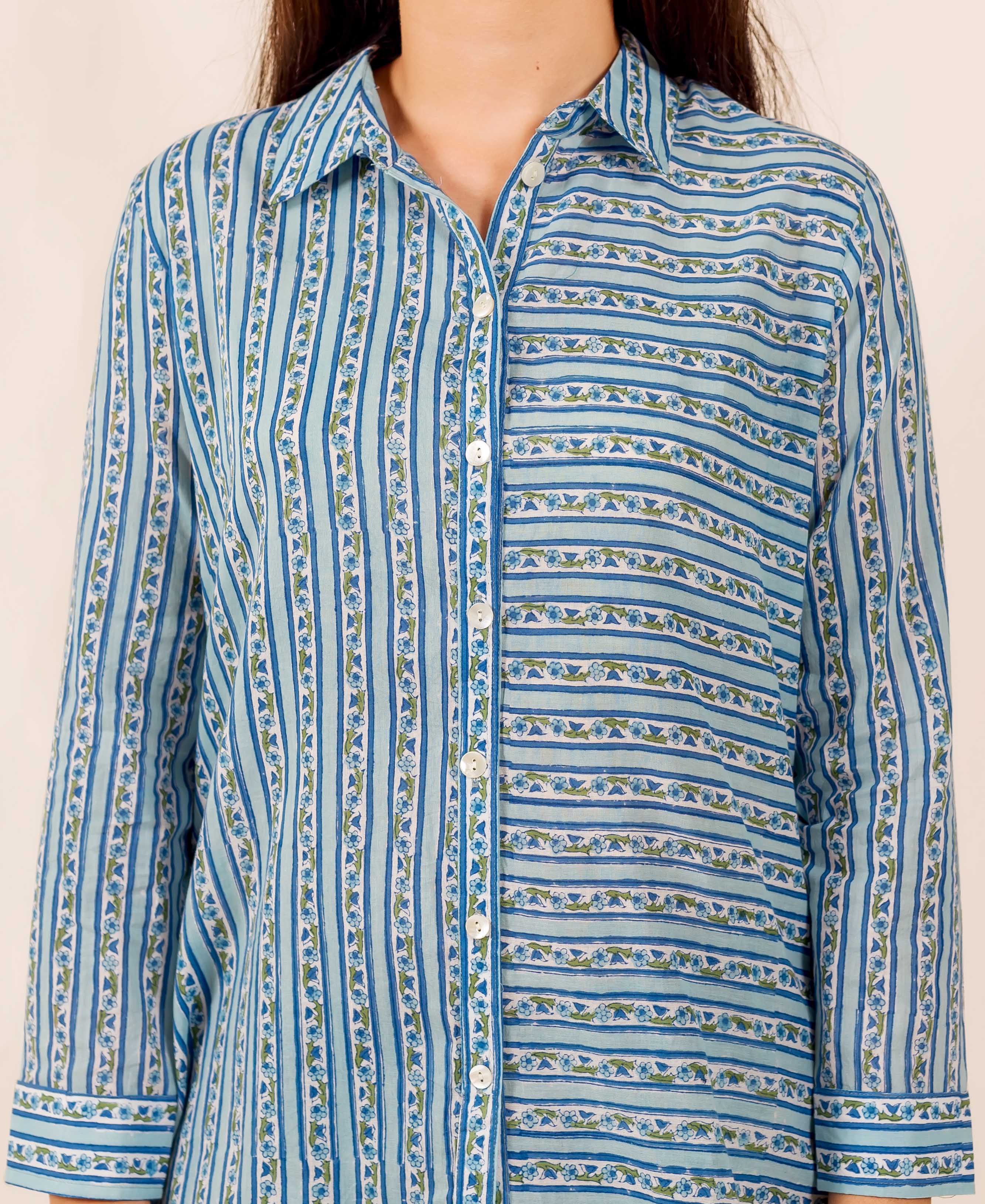 Front view of blue hand block printed shirt featuring contrasting vertical and horizontal floral stripes.