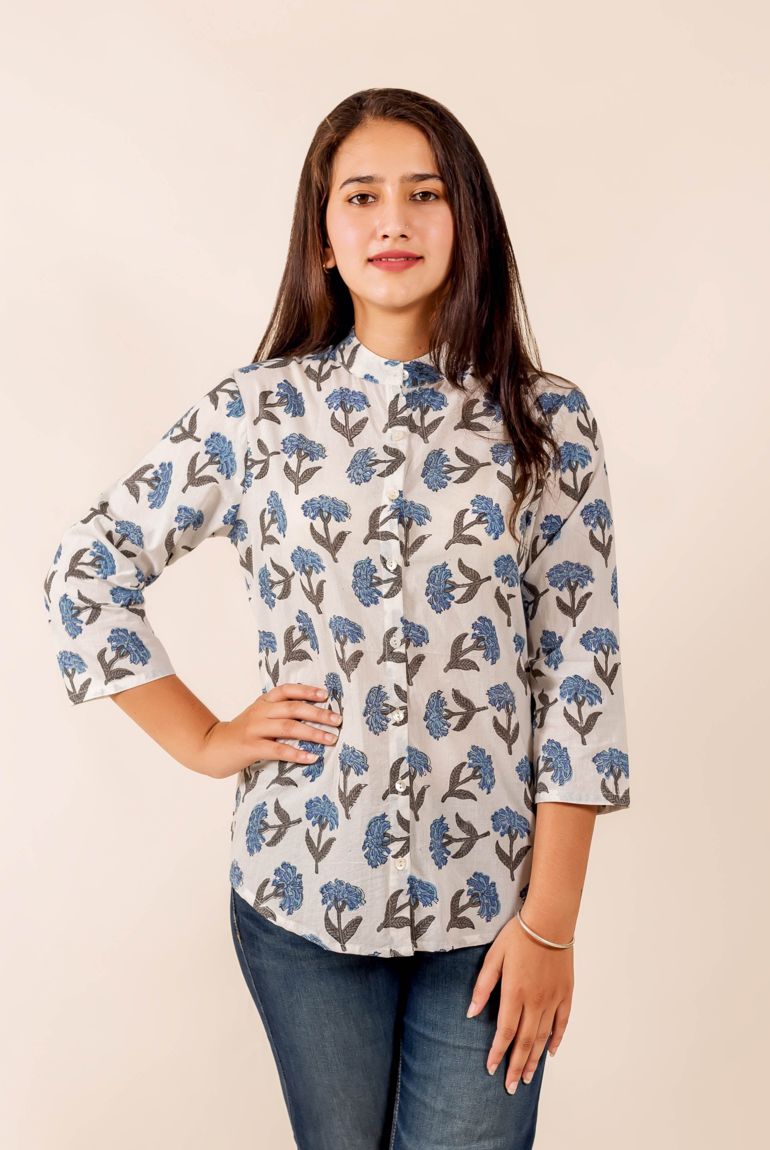 White and blue floral block print mandarin collared top on model, front view.