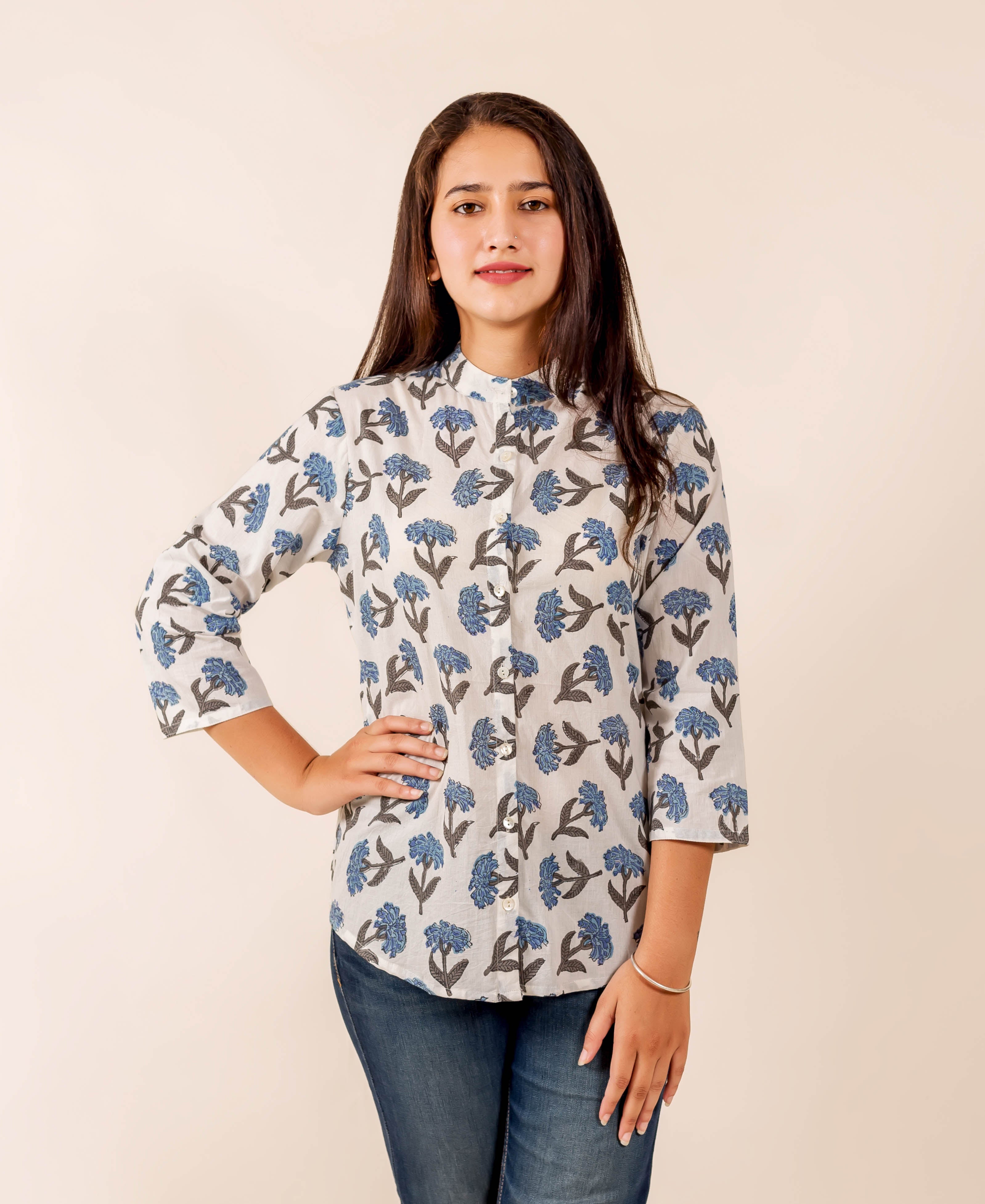 White and blue floral block print mandarin collared top on model, front view.