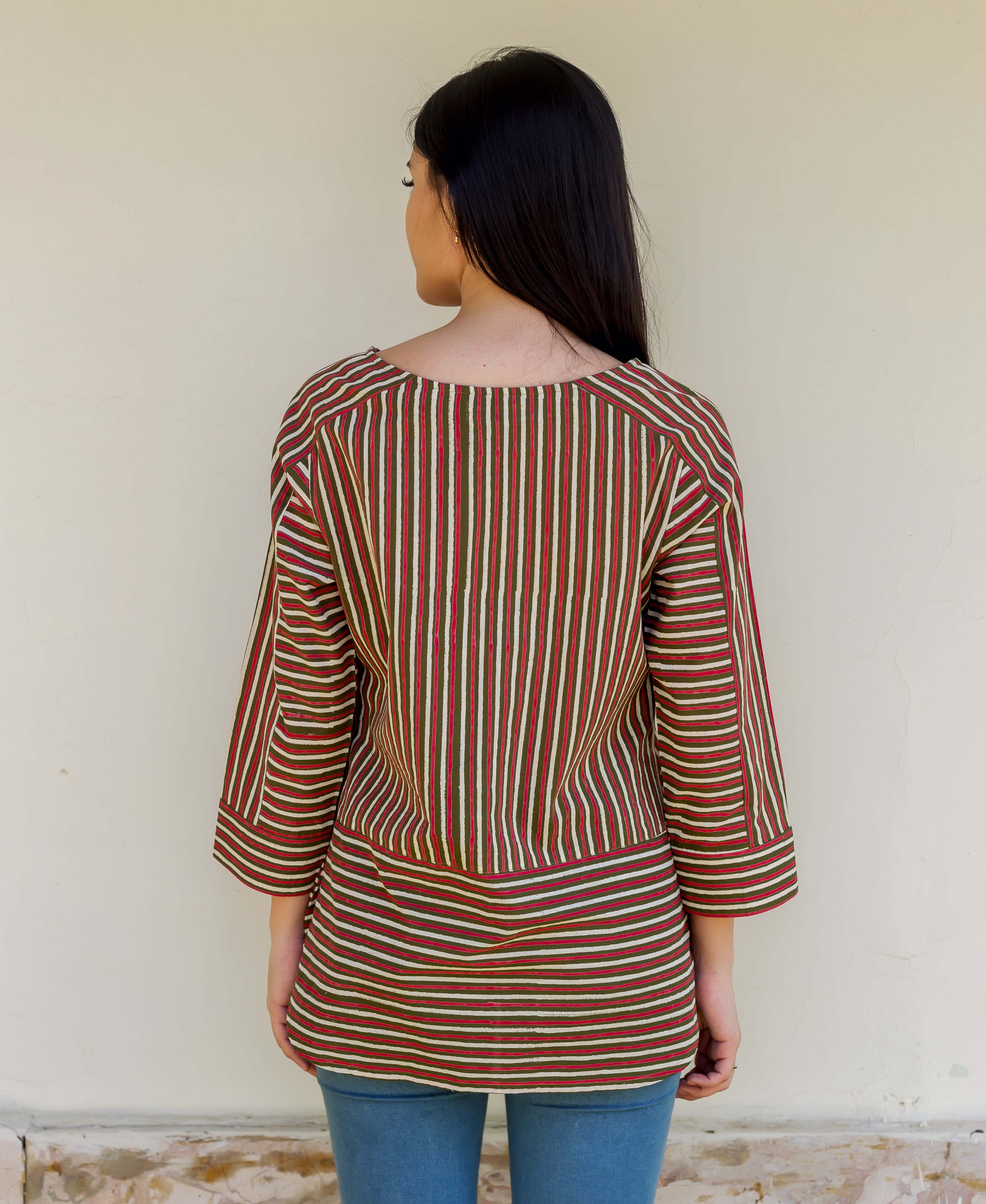 Back view of model wearing an olive green and red striped hand-block-printed top.