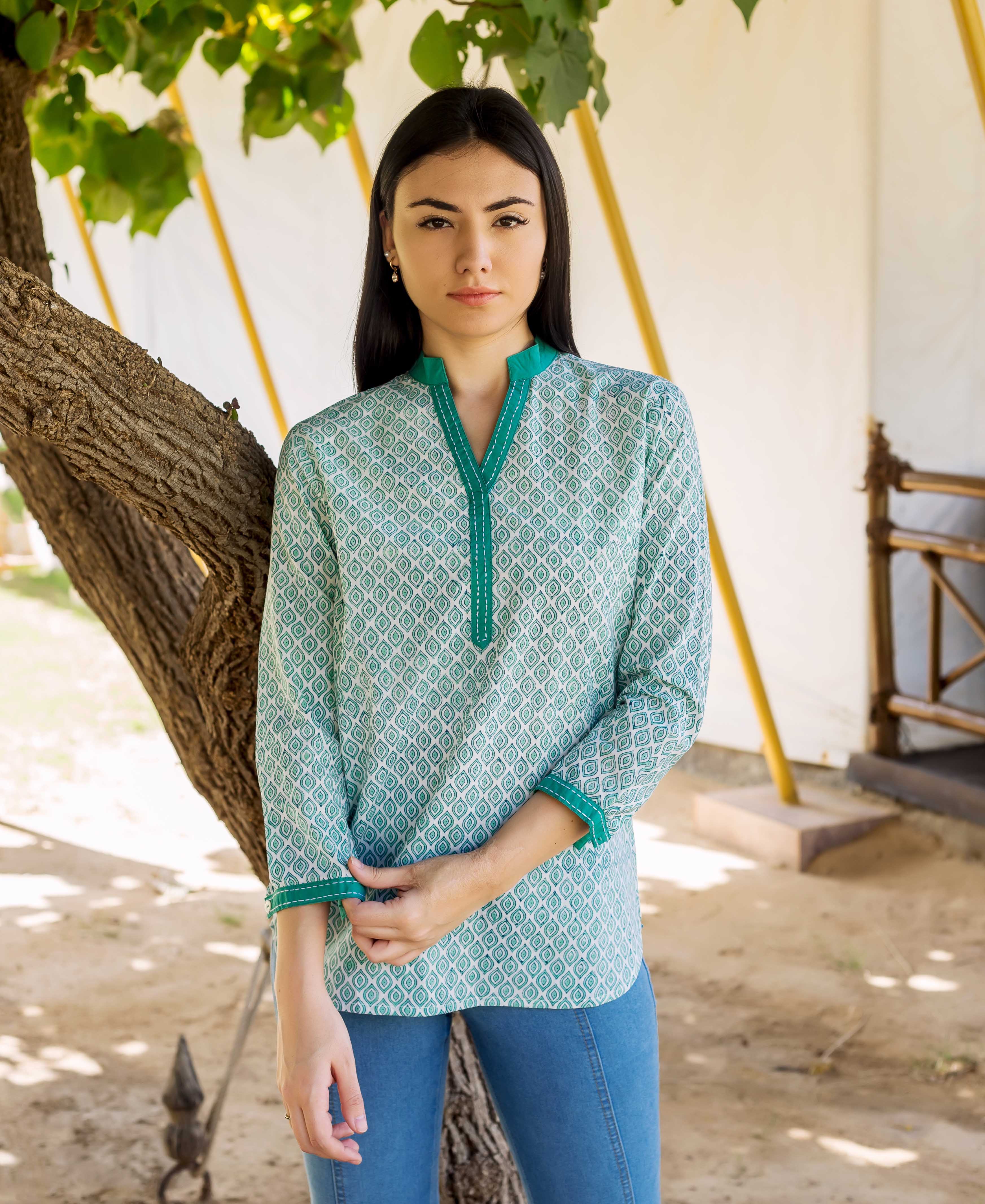 Front-facing model wears a white and green hand block printed top, intricate geometric pattern.
