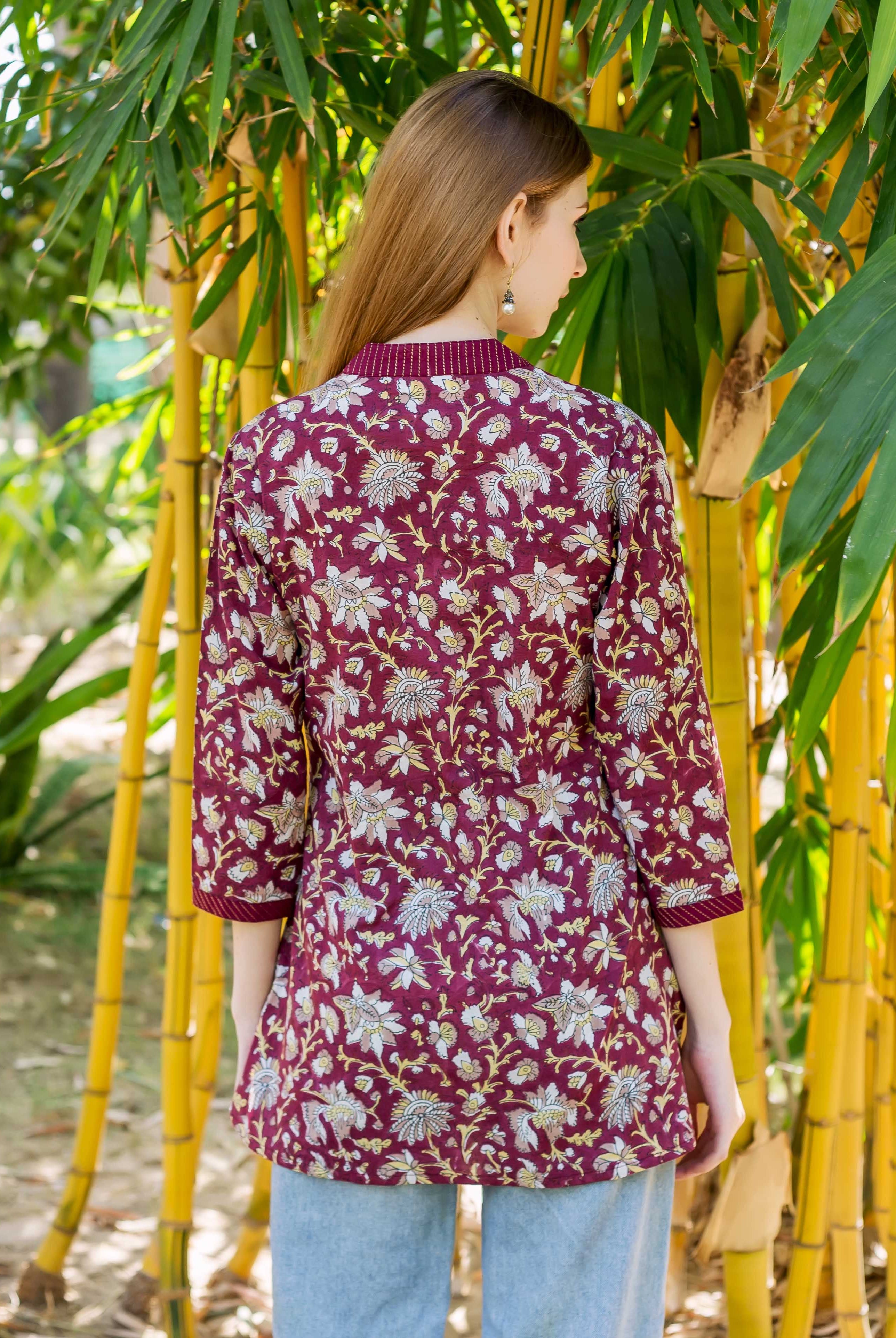 Wine Oivia Top, maroon with white and gold floral hand-block-print, on model from behind.