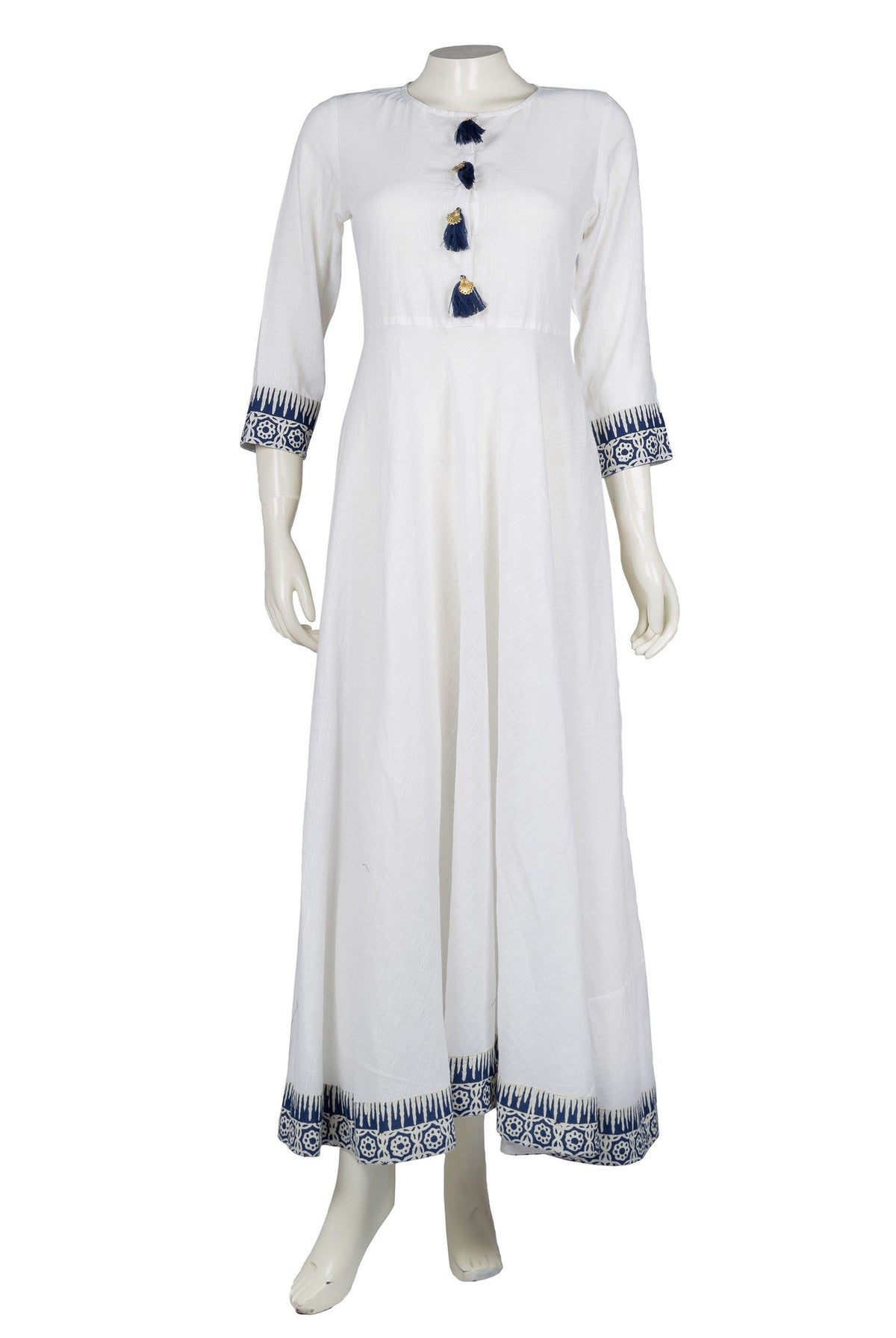 White empire cut Indo-Western maxi dress on mannequin, blue block print and tassels.