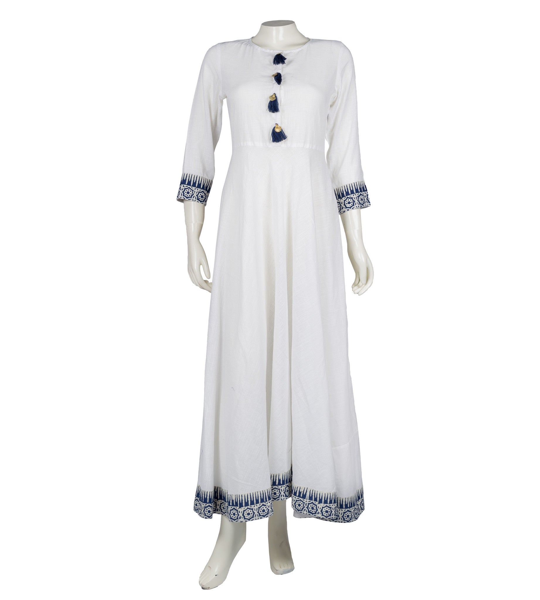 White empire cut Indo-Western maxi dress on mannequin, blue block print and tassels.