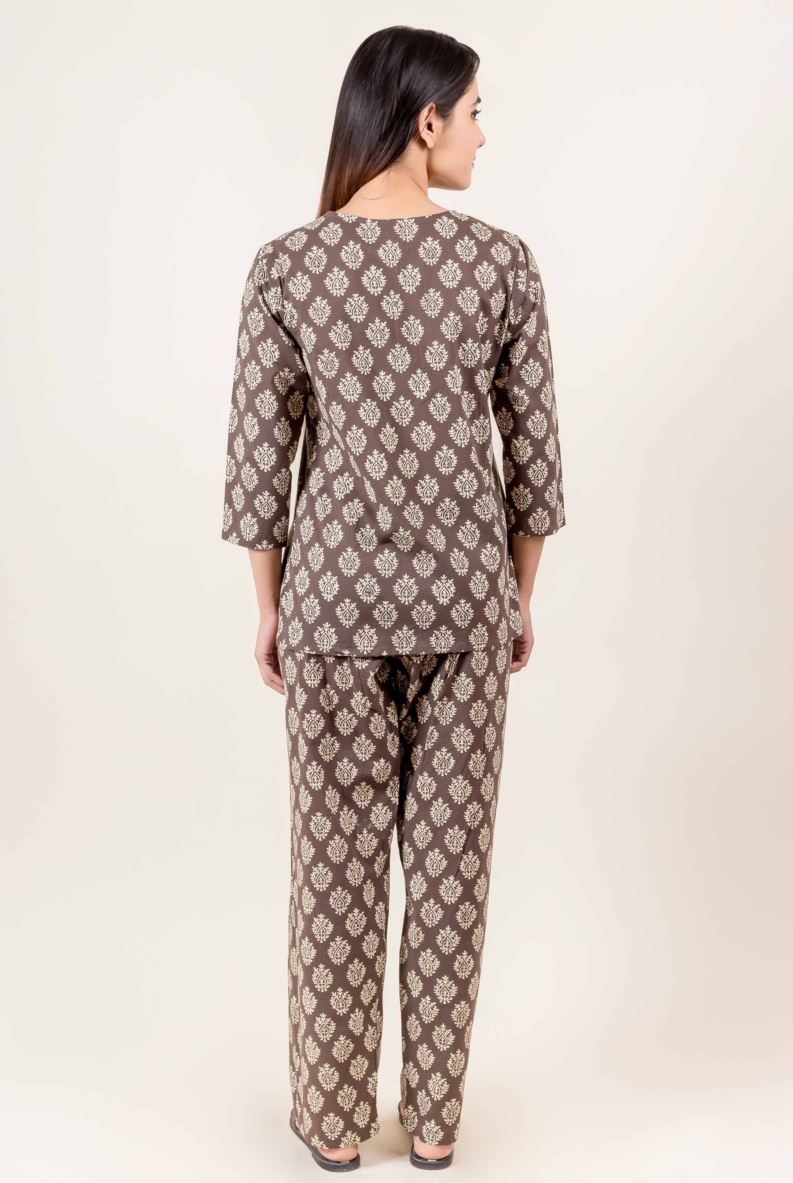 Back view of model in brown hand block printed ethnic top and pajama set.