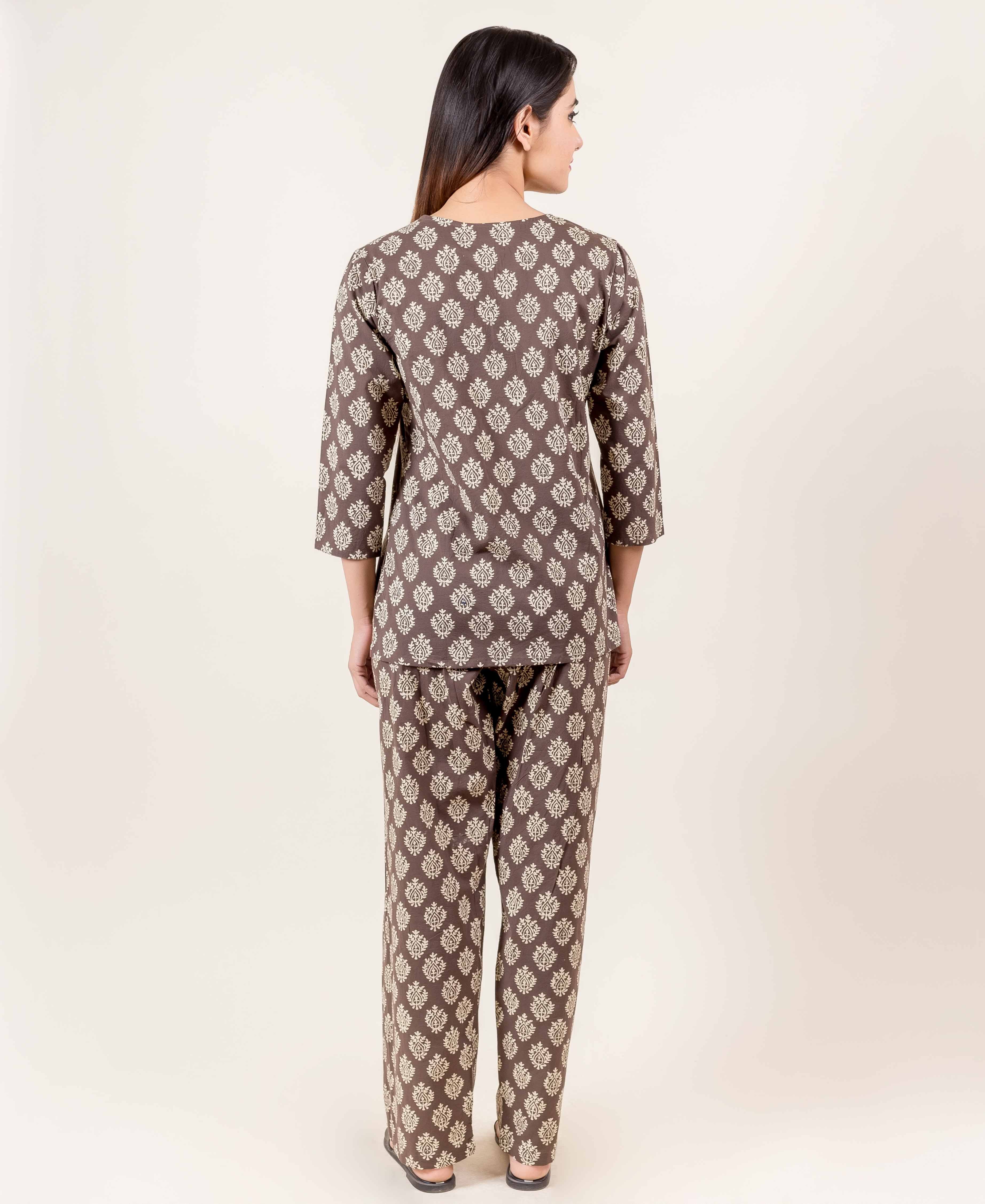 Back view of model in brown hand block printed ethnic top and pajama set.