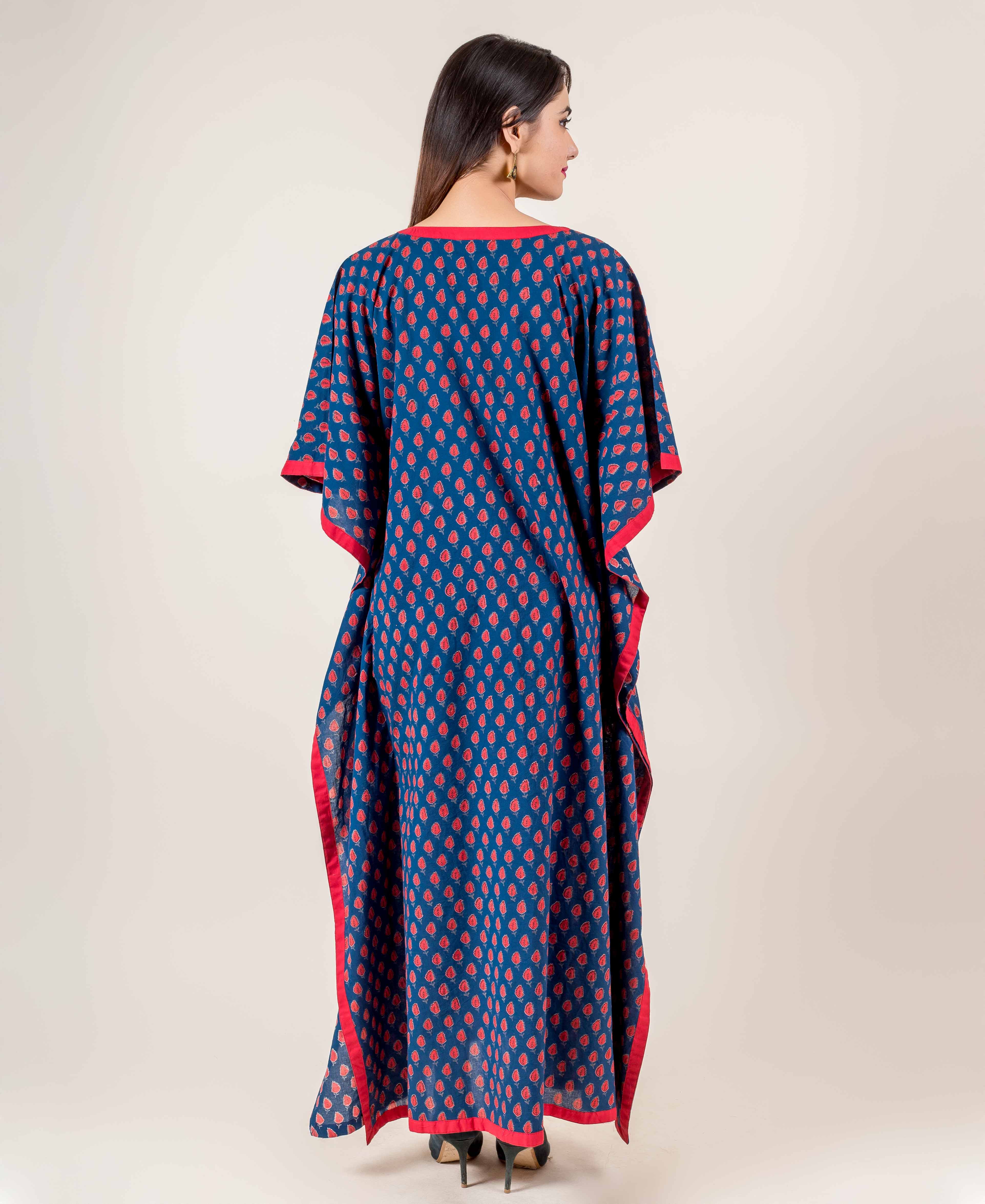 Back view of full-length blue hand block printed kaftan with red motifs and red trim.