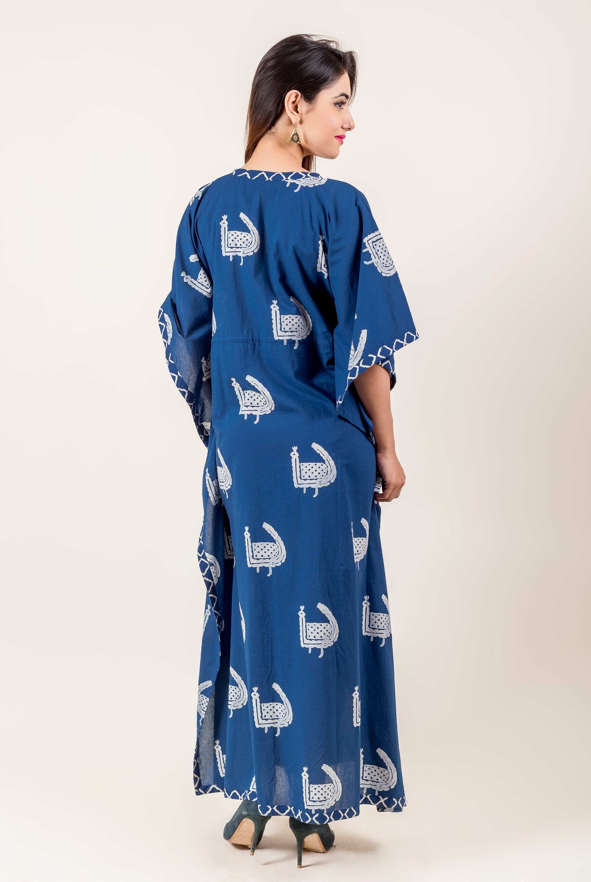 Full back view of model wearing a blue and white hand block printed ethnic kaftan.