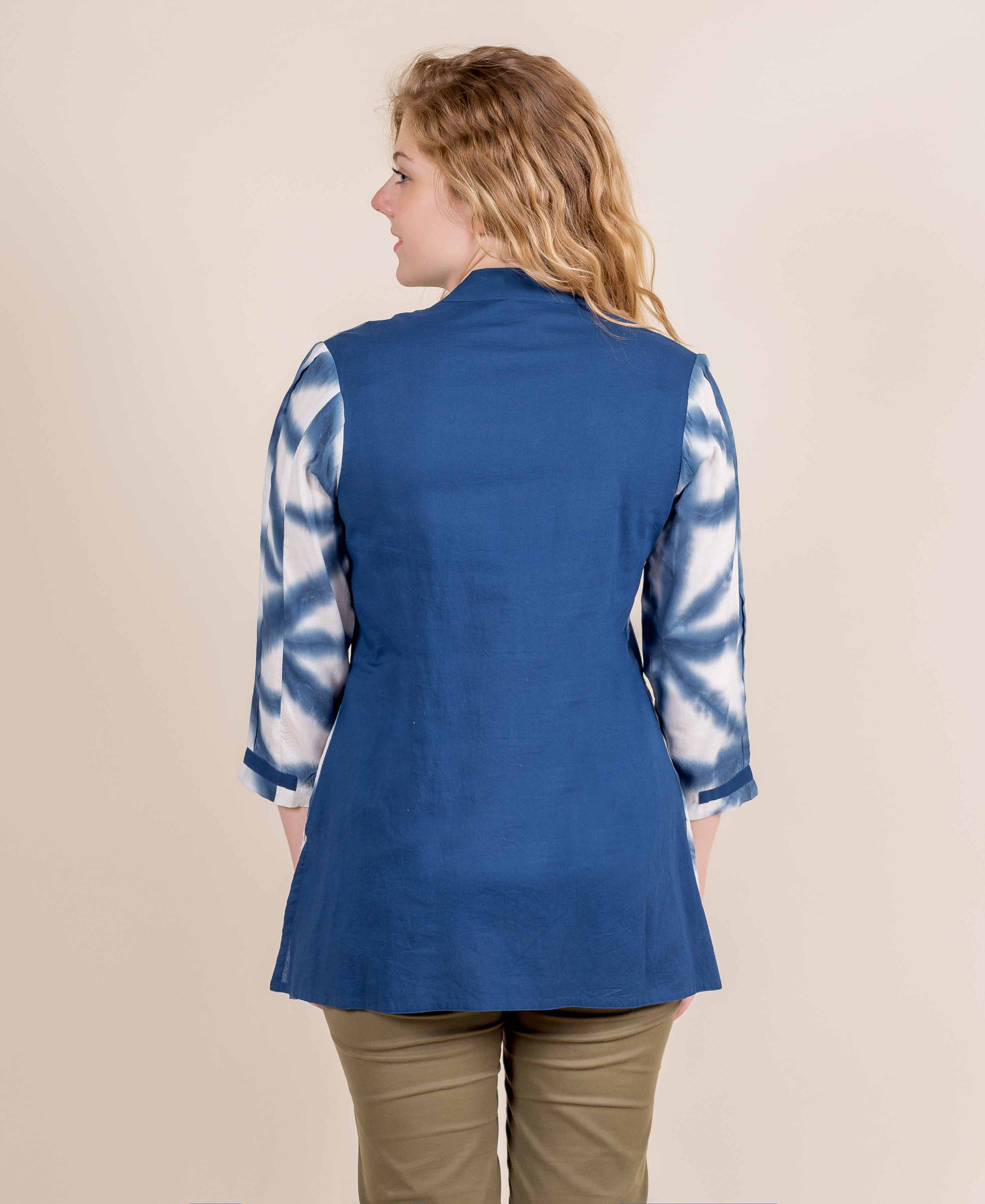 Back view of model wearing blue short kurta top with tie-dye sleeves.