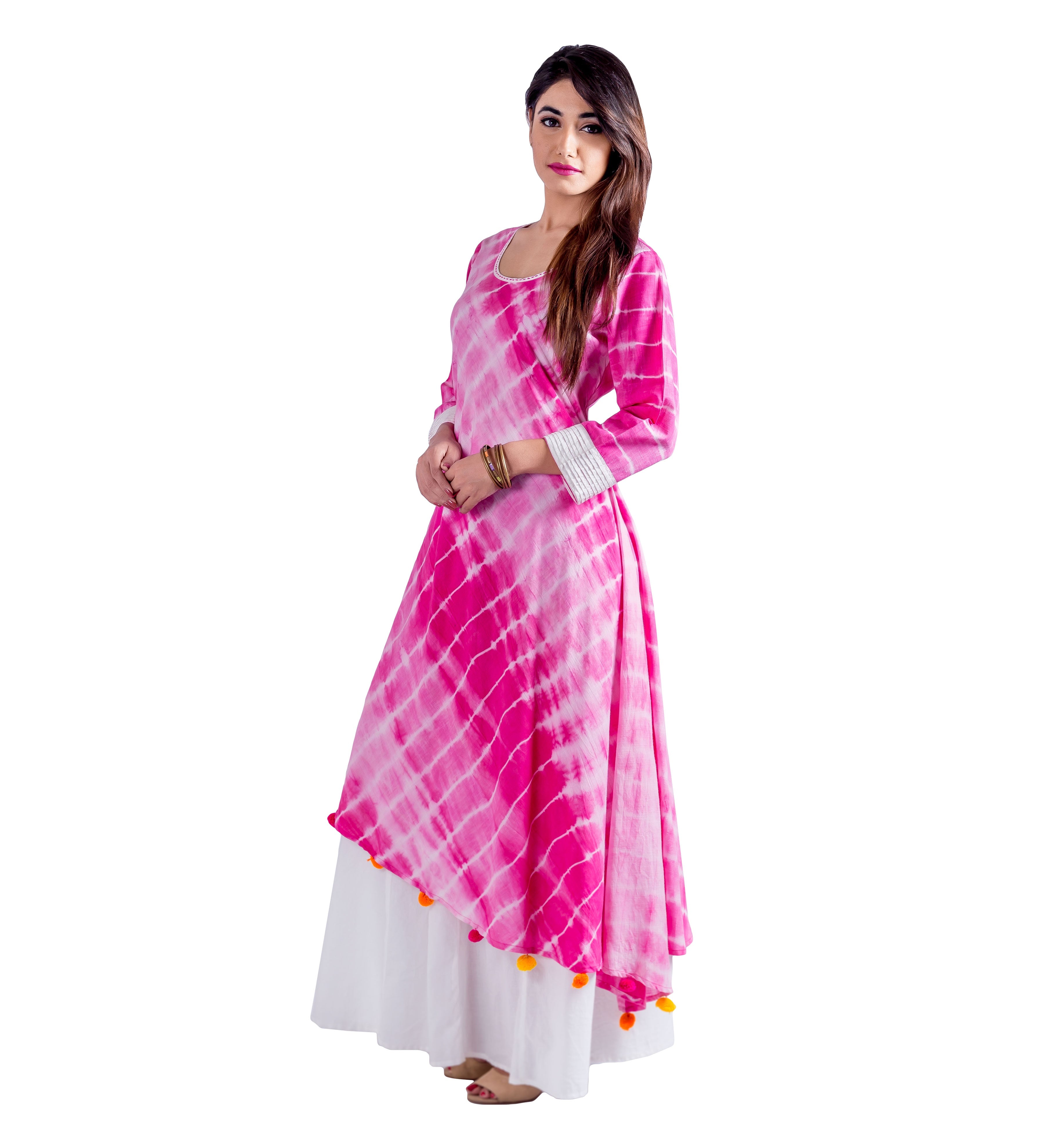 Model in fuchsia and white tie-dye asymmetrical Indo Western dress with orange pom-poms.